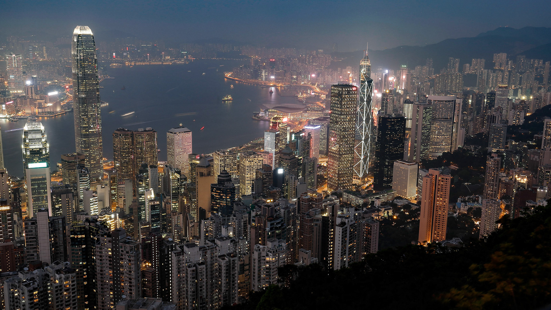 VICTORIA PEAK, HONG KONG- March 12, 2019 – Cold foggy evening night view of bustling city Hong Kong from Victoria Peak.