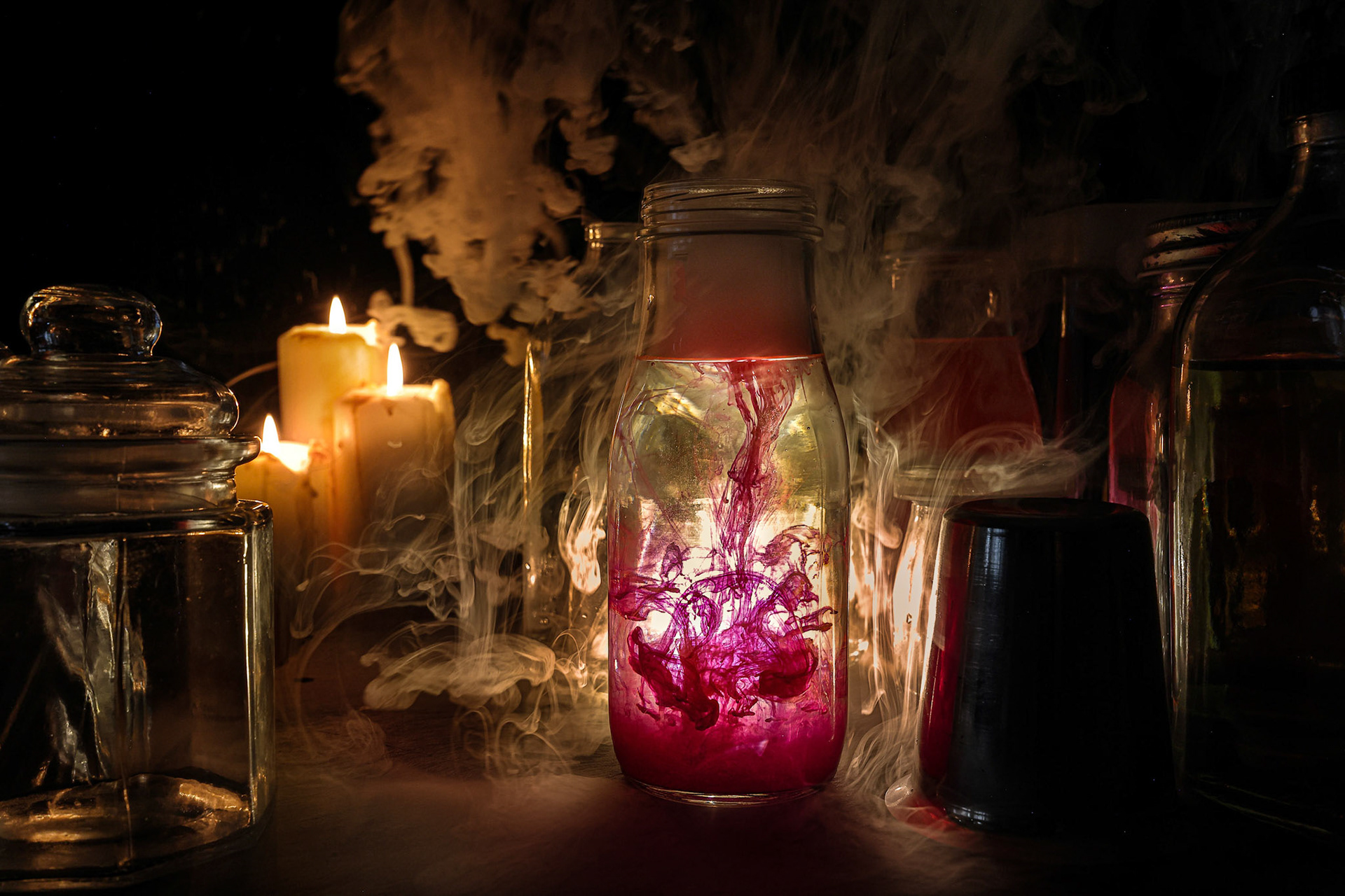 Alchemist laboratory mystery red ink flowing down bottle candle light smoke fog floating mistic flame spooky