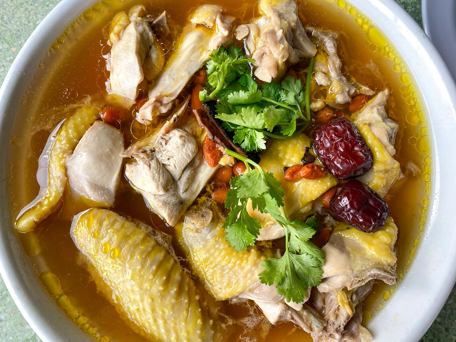 Chinese chicken goji berry clear broth soup healthy medicinal in bowl