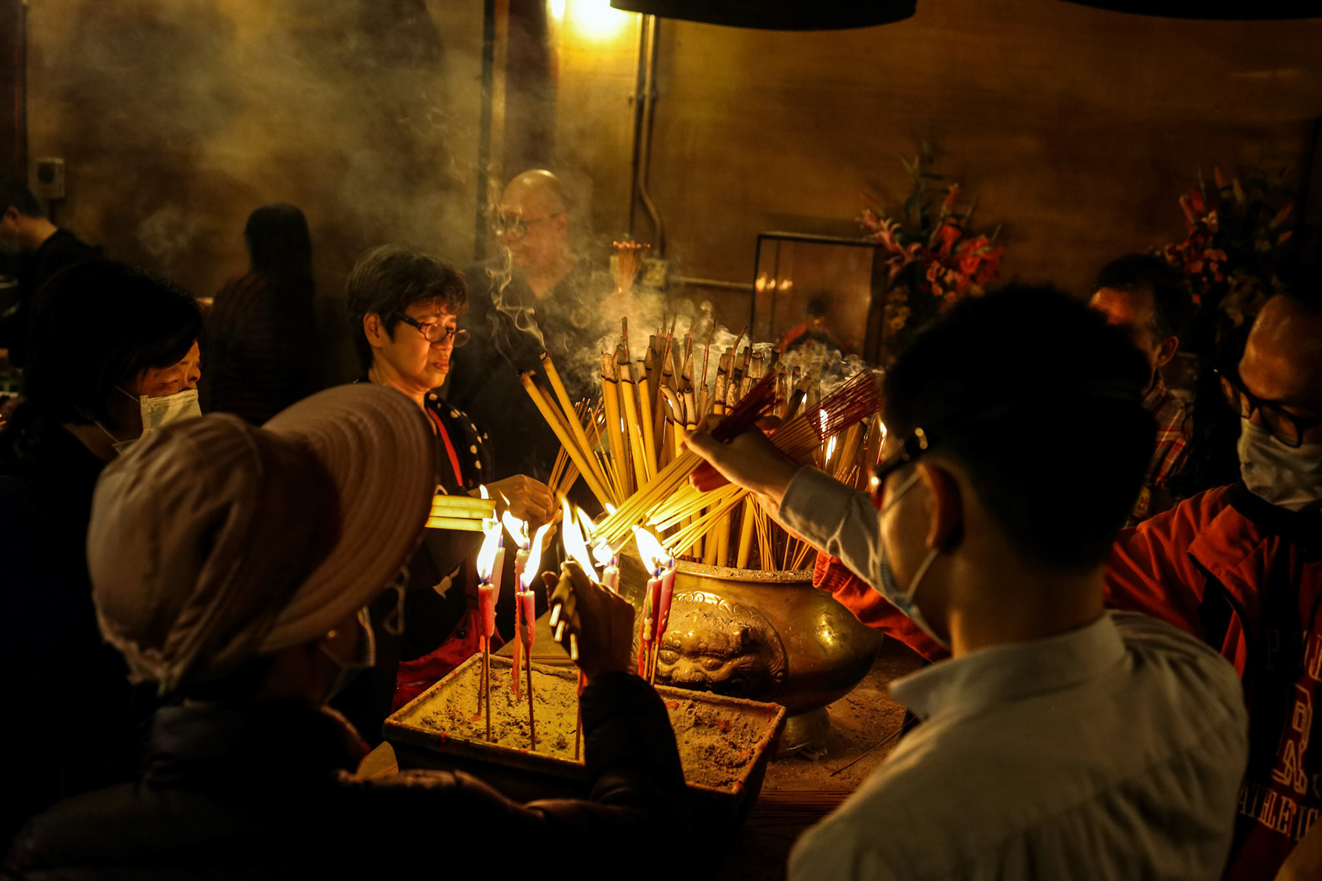 Hong Kong, Central-January 25, 2020 – Devotees at Man Mo Temple for offerings and prayers for Chinese New Year.  In mist of protest and Novel coronavirus, 2019-nCoV, COVID-19.