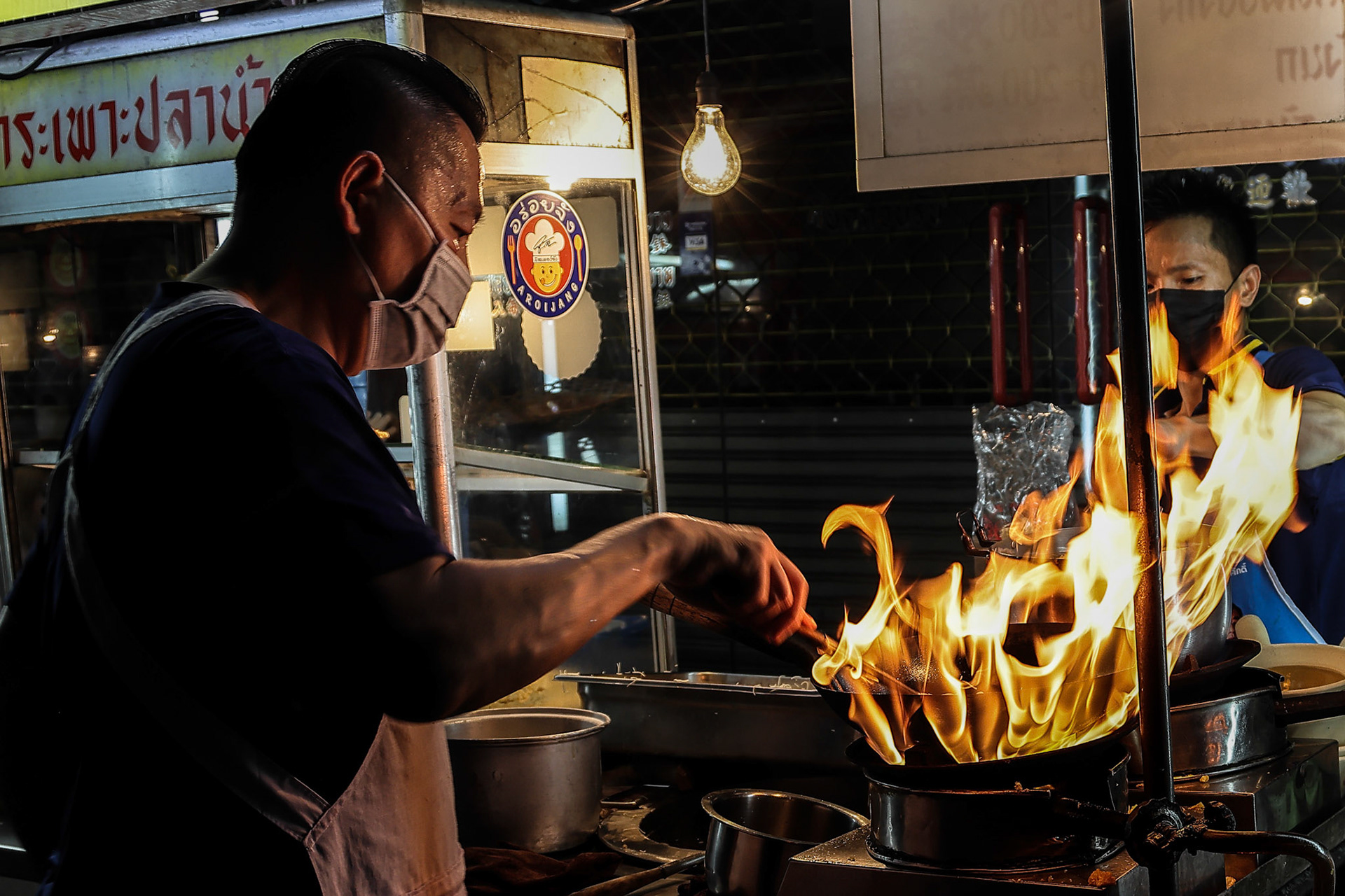 Bangkok, Thailand-July 28. 2022- Famous Bangkok Chinatown tourists visitors go to place for Micheline star award variety street food, neon light lit signs