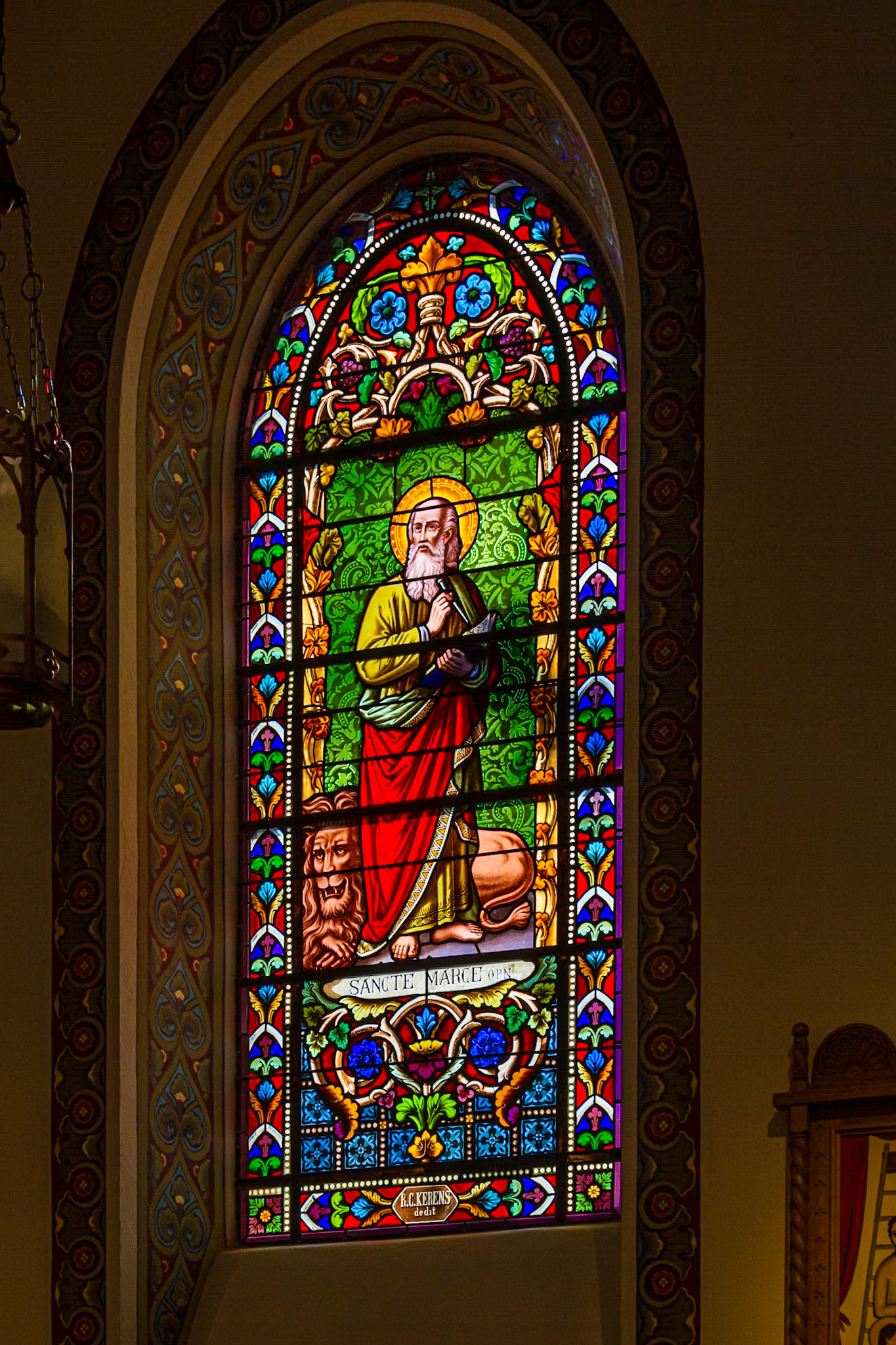 Windows influenced by a French Bishop in rebuilding the cathedral for a land with Spanish and Mexican culture for many years. Each window had a painted picture below it from the Mexican culture.