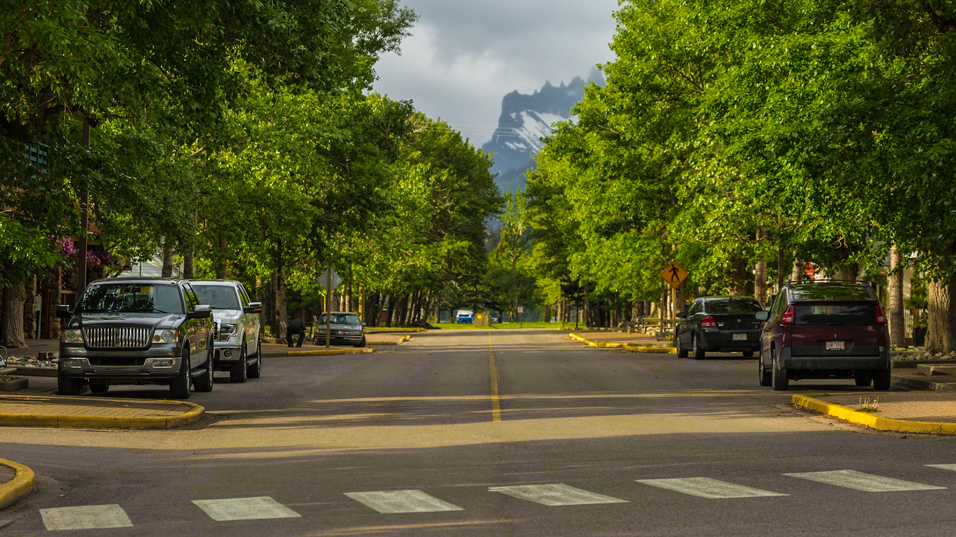 Walking from our hotel to breakfast, I got involved in finding a place to photograph the Prince of Wales Hotel, overlooking the town. Mark and I got separated for a while. The pictures of the hotel were not very satisfying. I did get two centerline shots. One was Waterton Avenue, near the place we were to eat. The other was a walking trail along the lake. When Mark and I found each other, a dud was giving him a line of bull about his personal life adventures. The couple I heard were highly improbable. It was funny. We were ready for breakfast.