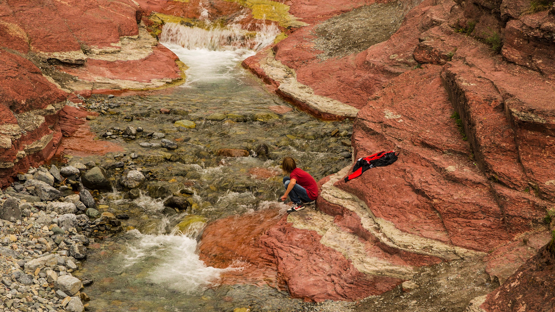 While we were on the bridge, enjoying the scene, a couple of boys came into the canyon with an interest in the water.  A few minutes later, their father was on the bridge. It was obvious he enjoyed watching them. He was having his Father’s day in Waterton as well. I talked with him a few minutes. As I understood, they have homes in Montana and east of Waterton somewhere.