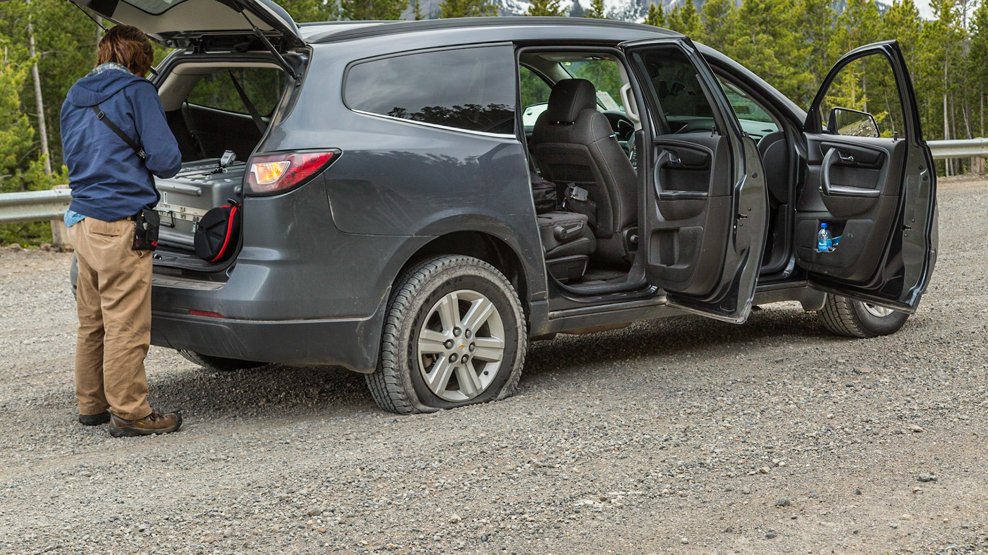 Every adventure needs a mishap. We were gone from home 8 days, carrying a lot of photographic equipment and other stuff. To my knowledge, this tire was the only thing we lost. When it happened, I was in denial until we got stopped and Mark said “No, it is flat.” The torn place was at least an inch long. Otherwise, I was in luck, with a thirty year old guy thrilled to set up a GoPro camera to record the entire operation. It’s not joke. He had the tripod set up in just the right place, before we started figuring out how to get the temporary tire and jack out of the curious storage places. His camera rigging took about the same amount of thought as getting ready to jack the car. Then I was able to enjoy the wilderness beauty while he became the star of his movie.