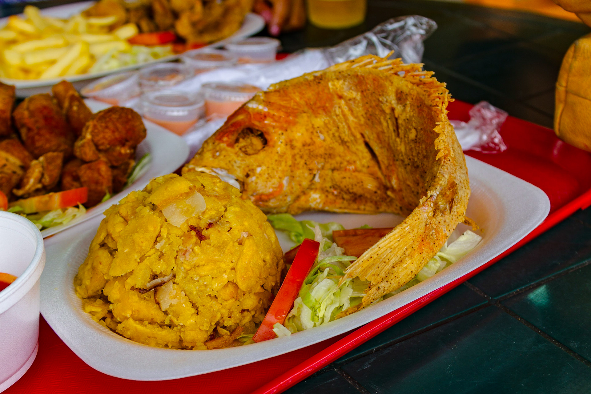 Of course, we had to spend a little time at the marina and boardwalk for Playa Ponce.  Lunch was a good reason to go there. About half way through my octopus fritters, a woman near me was served this red snapper. She was gratious in letting me get this shot.