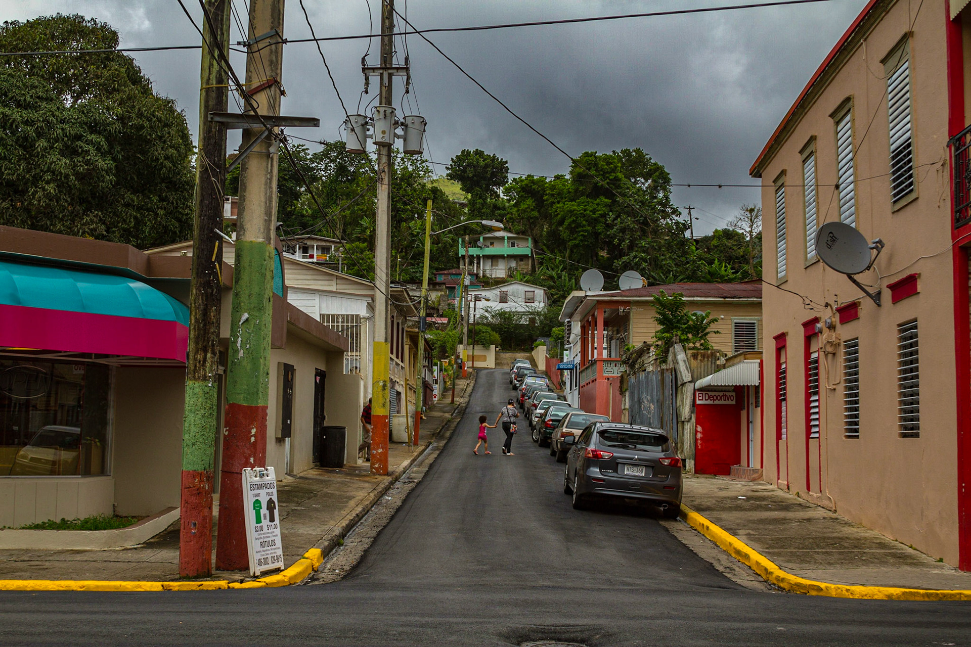 Adjuntas Puerito Rico, June 15, 2013, This is a typical street leading from the plaza.  Yes, it is a pretty moutainous city.