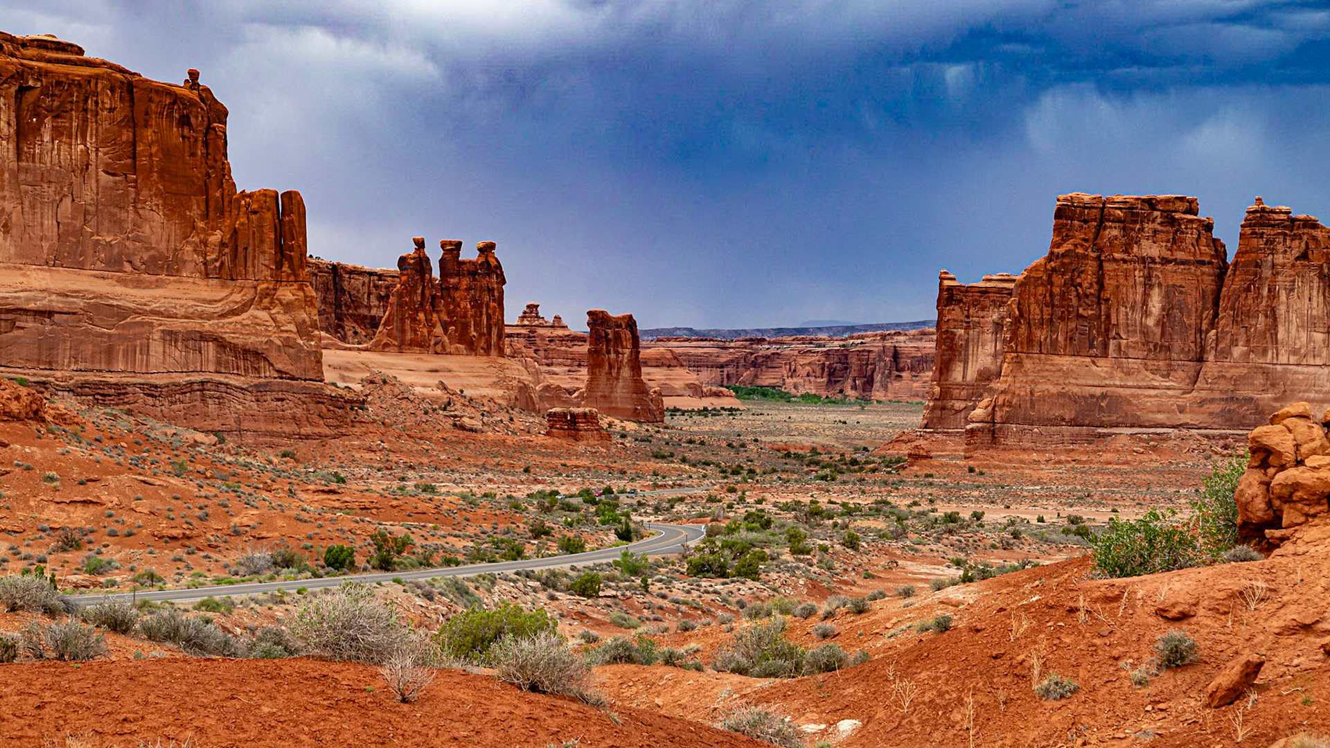 La Sal Mountains View with Three Gossips - Left of center tere are three figures that resemble people in conversation.