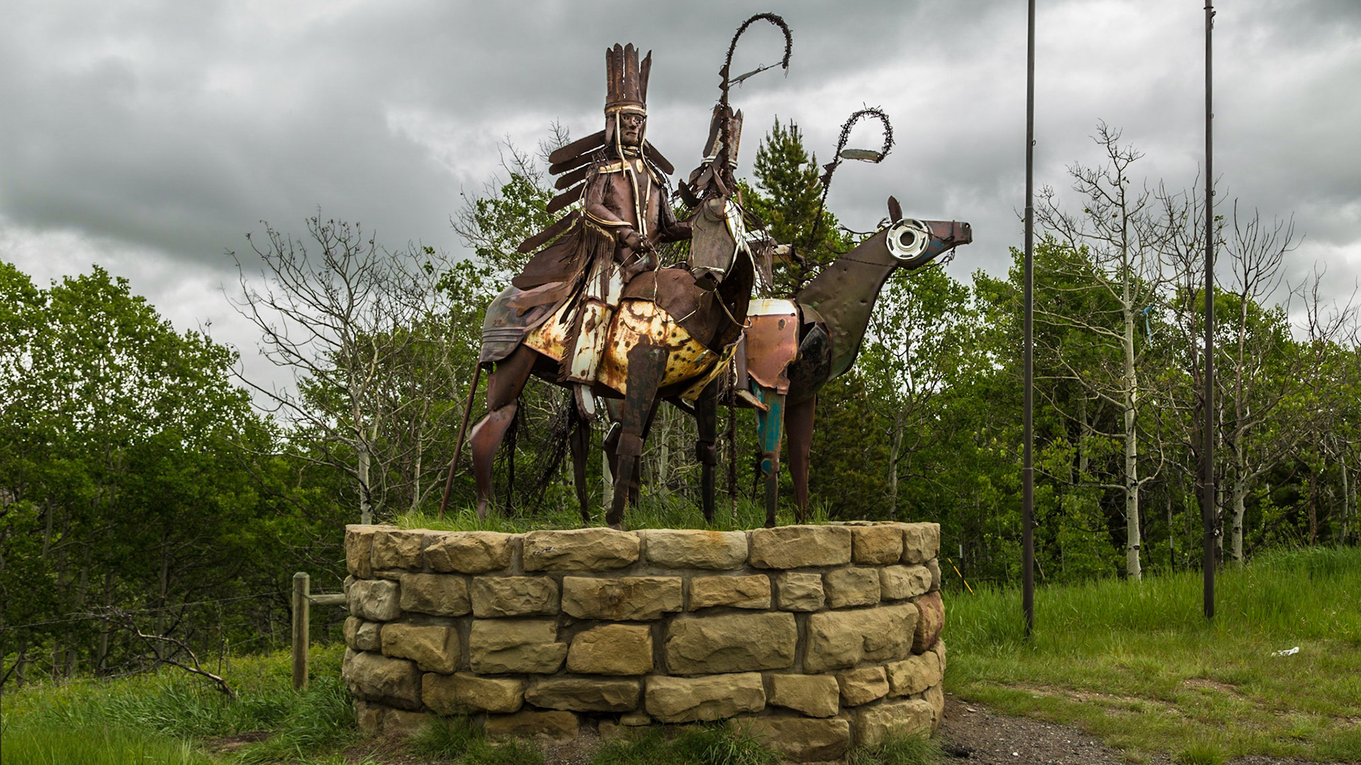 In June 2001, Christie, Mark and I drove from Denver to Portland, on a road trip that took us through some of the area covered on this 2014 trip. From that trip, I have remembered sculptures of three Indians at an intersection on the prairie. The metal parts seemed to have originated as automobile parts. In my mind, they have always been majestic and I regretted that they seemed too far out of our way this year. These are less dramatic than my memory of those. They are still intriguing.  It seems they may be near the borders of the Blackfoot Indian Reservation.