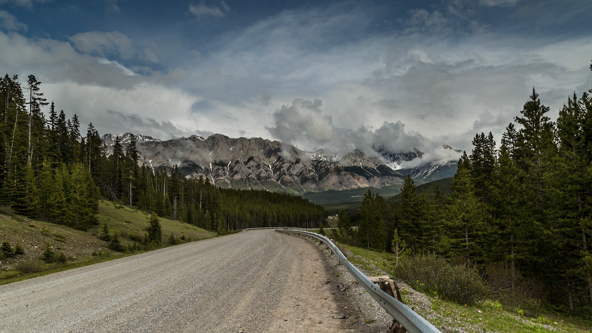 Every adventure needs a mishap. We were gone from home 8 days, carrying a lot of photographic equipment and other stuff. To my knowledge, this tire was the only thing we lost. When it happened, I was in denial until we got stopped and Mark said “No, it is flat.” The torn place was at least an inch long. Otherwise, I was in luck, with a thirty year old guy thrilled to set up a GoPro camera to record the entire operation. It’s not joke. He had the tripod set up in just the right place, before we started figuring out how to get the temporary tire and jack out of the curious storage places. His camera rigging took about the same amount of thought as getting ready to jack the car. Then I was able to enjoy the wilderness beauty while he became the star of his movie.