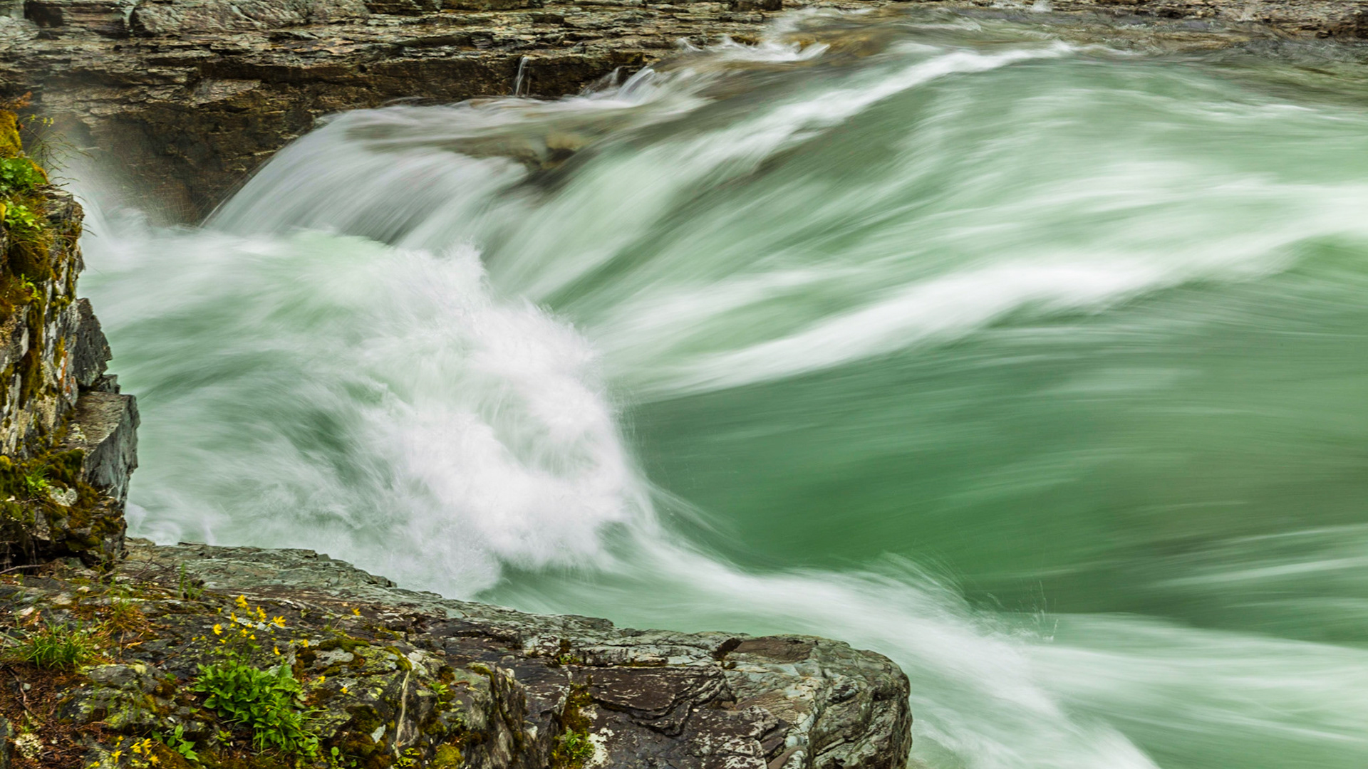On our first evening on the ground, we drove from the Kalispell, MT airport to Whitefish, then into Glacier National Park along Lake McDonald and McDonald Creek. An interesting waterfall got us out of the car. My best image from the stop was Mark looking very professional as he worked on his shots of the falls.