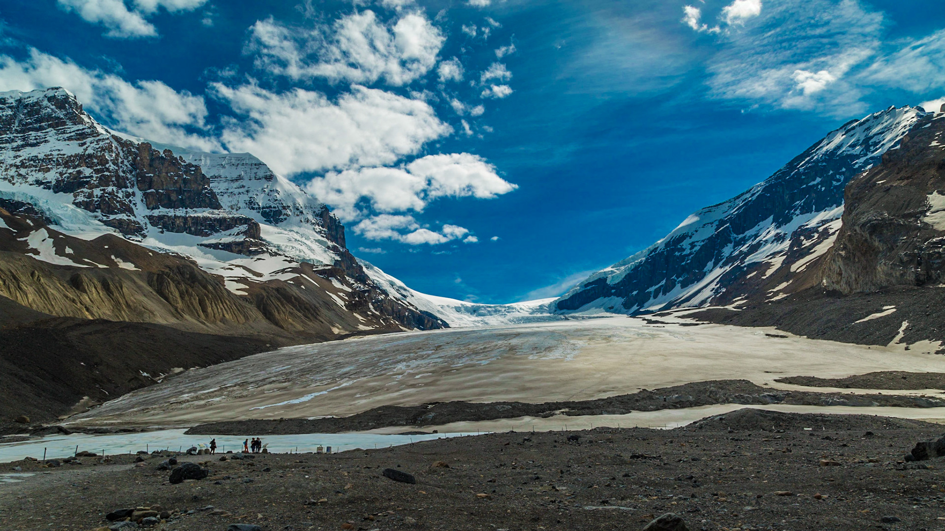 The glacier is huge and the few people closer to it provide some sense of the size.  In this area, I found a rock with sparkly gold colored points and imagine it might be threads of gold.  Unfortunately, it turned out to be iron pyrite – fool’s gold.  I still have it though.  Maybe I should take it back.