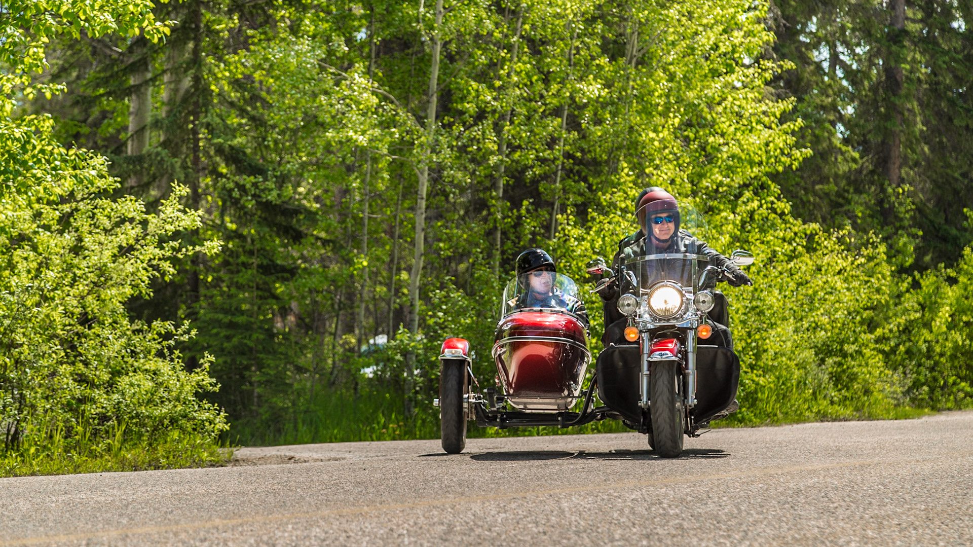 After a day that was mostly getting the flat tire replaced, a pub lunch and our hurried trip north on Icefield Parkway (June 17), we were ready to head south on the route that inspired Jasper, Alberta for this Father’s Day adventure. Highway 93 runs from Jasper to the Mexican border, through a vast array of landscapes. This year, we made it from Jasper to Kalispell. In 2015, we currently expect another lag of the trip. At the rate we travel, it may take three to four years to see all of Highway 93, if we actually make it. Until this point, the 2014 trip was an interesting way to reach our starting point.  The reasons have to do with airline schedules and my interest in seeing this route to Jasper.We began southbound on Icefield Parkway, with time for stops. Soon, we took a turn for a closer view of the Athabasca River, where we met five or six motorcycles with sidecars. Our reaction was wishing for a chance to shoot pictures. When this road turned away from the river we returned to a picnic area on the river. The motorcycles were there. It turns out they were not some kind of club, as we imagined. They were a Jasper tourist attraction. Guys in their 40s or 50s drove, carrying two tourists each – aging couples in this case. They were resting, before their return to Jasper on the road that might have been the “old highway” into Jasper.  We talked long enough to get a sense for their “mission.” That ride was probably expensive. When they were climbing into and onto the machines, we headed to setup for their departure. We got our chance for the shots we wanted earlier.