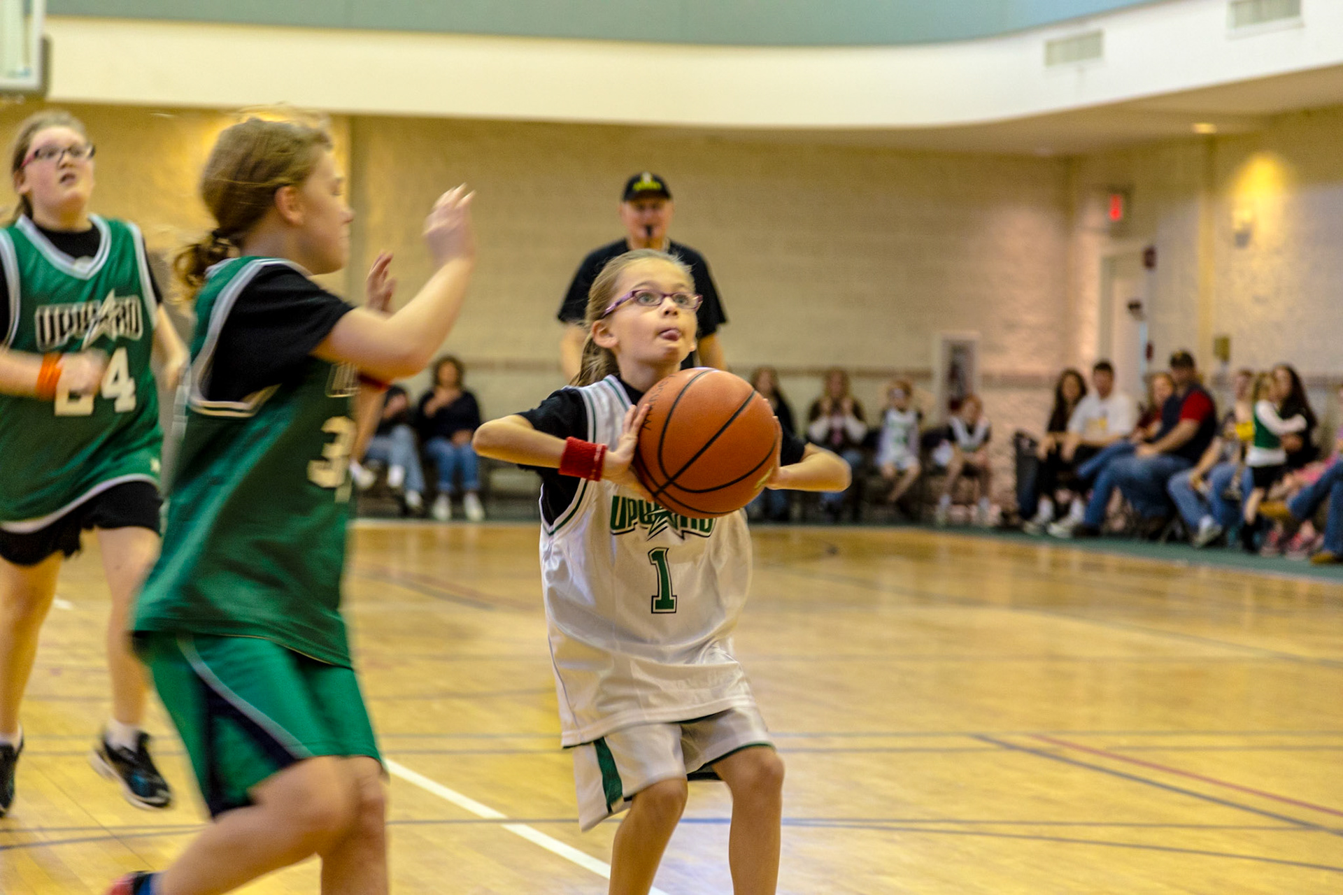 This is the third year a trip to Josephine's birthday party meant watching Trever and Grace, her older siblings, play basketball at Munsey United Methodist Church.  The first time was not really Josephine's birthday.  It was a few days after her birth. So, this trip was at the time she turned 2.  Michael Estes is Grace's coach. Christie and I have known him several years.
