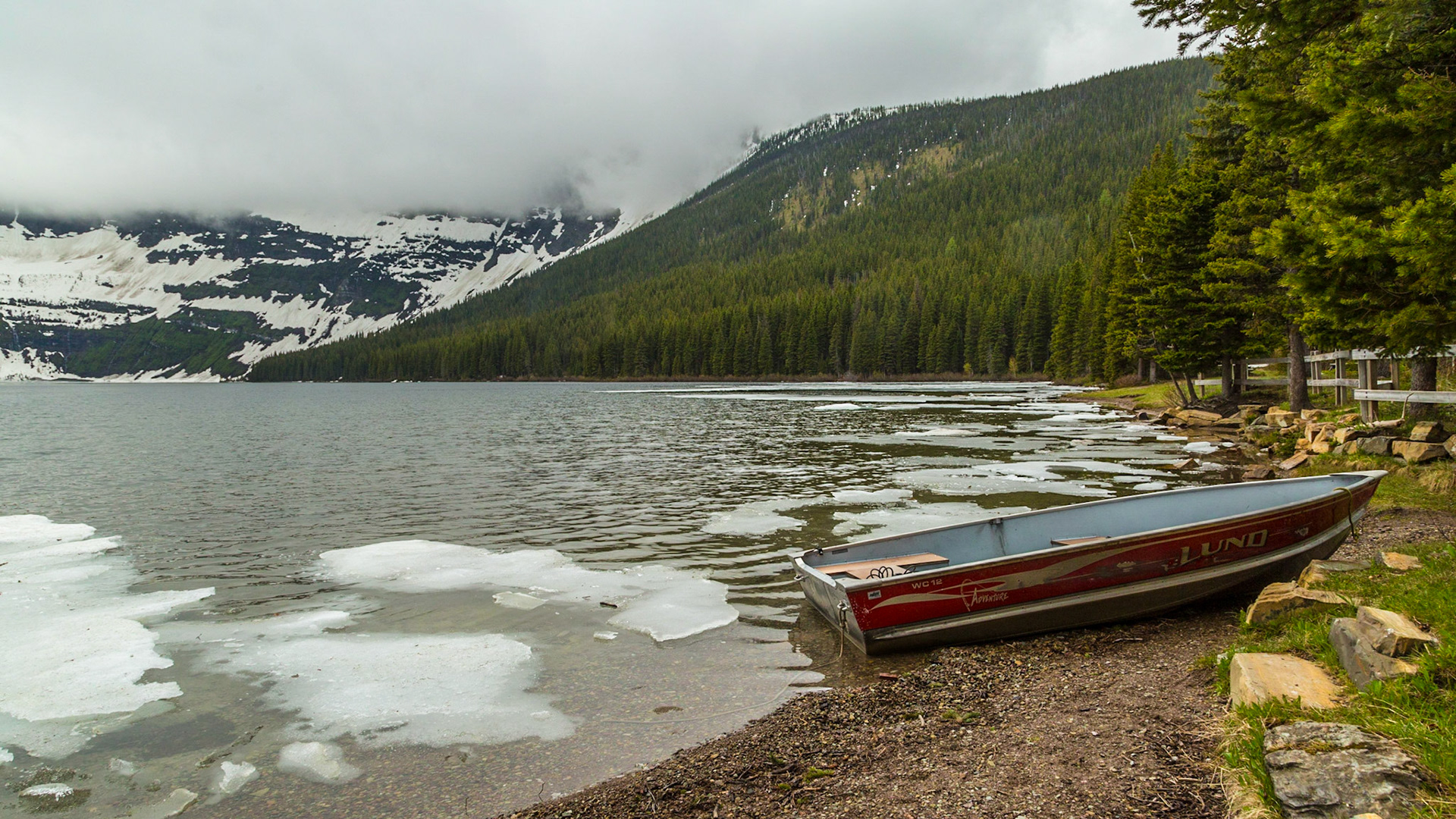 Despite the ice on the lake and no one renting the boats, there were a couple of men washing one of them on the shore just out of this scene. A few people came and left while we were there. It was pretty cool and drizzly. Nevertheless, it was an attractive scene.  I suspect the busy tourist season is a little later than we were there.