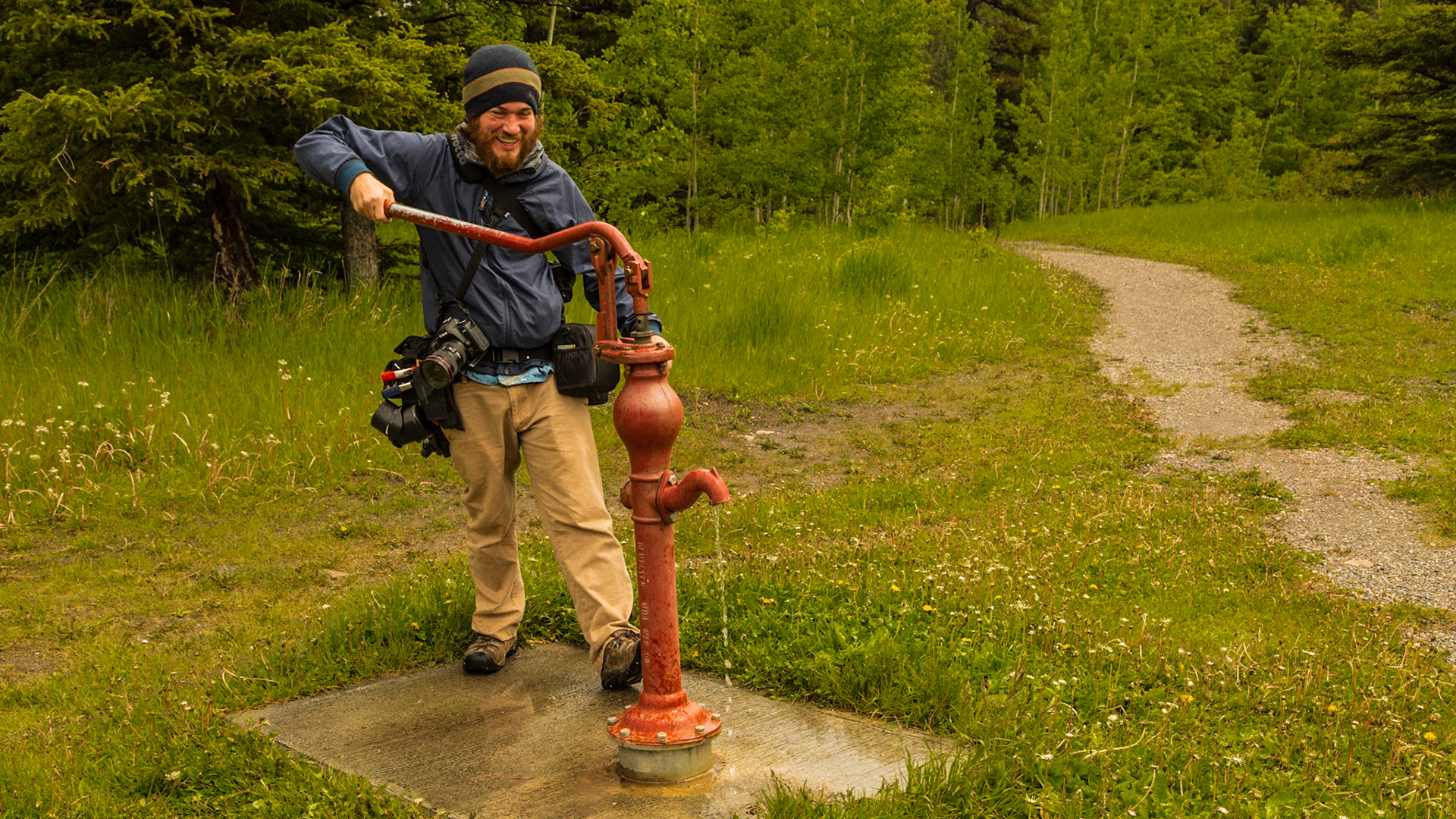 One of the interesting things in the Kananaskis River Park was a classic pump design. Mark had not seen one. I could remember them at both my Lewis and Parkey grandparents’ homes. I talked about remembering the flavor of water from those wells, particularly Grandmother Lewis’ well. I also told Mark of a cowboy song from my youth, about leaving a jar of water for the next person to “prime the pump.” The ballad illustrated the ethics in helping an unknown next person at the well and the courage it would take to pour the water into the pump instead of drinking it. The well could be dry, in which case priming the pump would waste the little water there was there.  But, if it worked, there would be enough water to fill everything the cowboy had for carrying it.  The lyrics are at http://www.songlyrics.com/the-kingston-trio/desert-pete-lyrics/