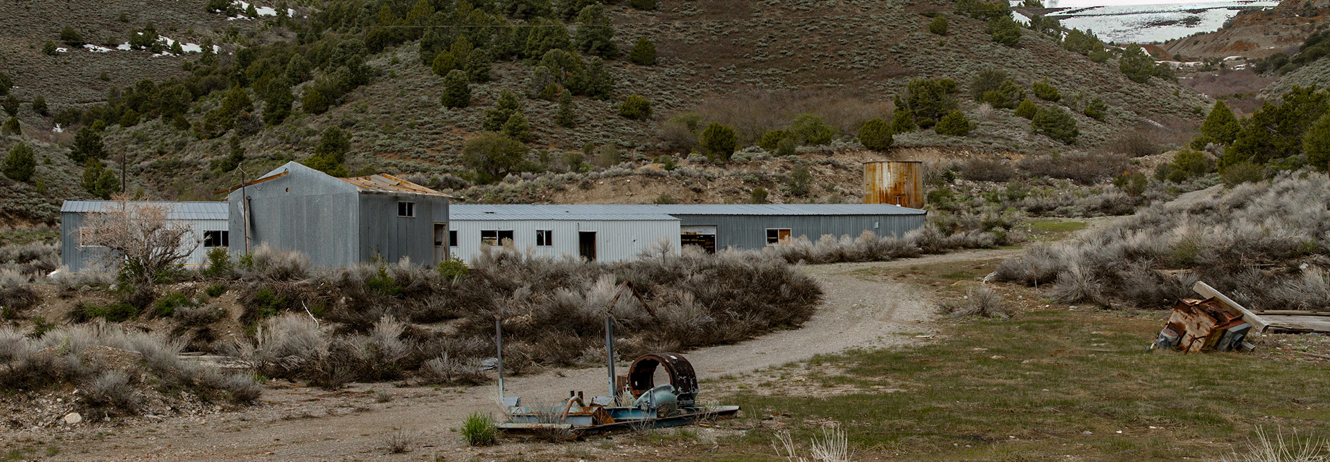 Ward Mining District, Ely, Nevada, May 22, 2011 - The first real stop on the Sunday morning was the Ward Mining District.  There was a cemetery, where I roamed and photographed stones for a while.  It was morning and the light was good.  The markers described the people who moved among these mining towns.  Apparently virtually this entire town was actually disassembled and moved to another location when the gold and silver deposits ran out.  Nearby, I found abandon buildings that looked more modern than the other old towns I found.  There was not an explanation for these metal structures.  An open garage door revealed shelving with core drilling samples.  Someone must have spent a lot of money looking for more feasible ore.