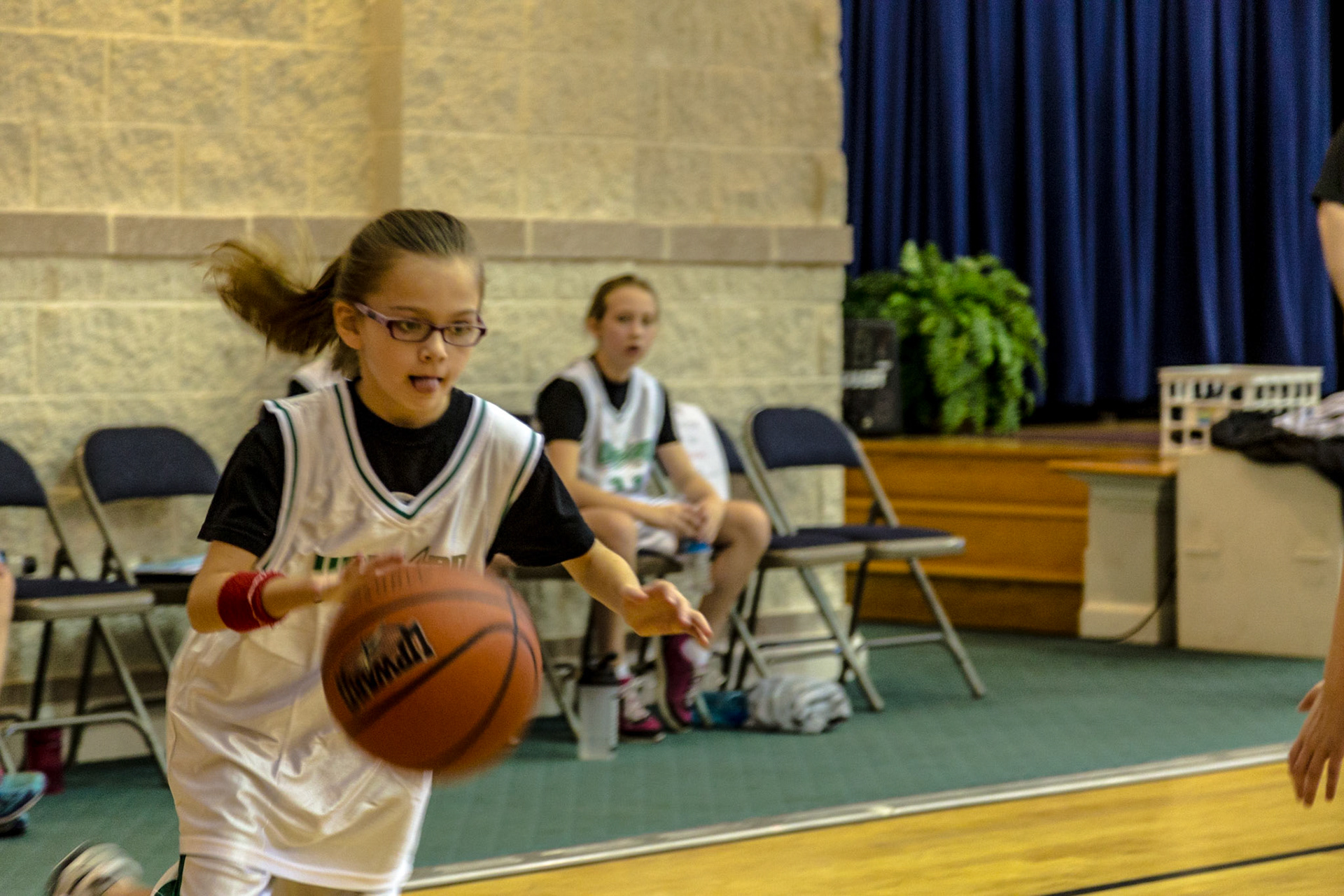 This is the third year a trip to Josephine's birthday party meant watching Trever and Grace, her older siblings, play basketball at Munsey United Methodist Church.  The first time was not really Josephine's birthday.  It was a few days after her birth. So, this trip was at the time she turned 2.  Michael Estes is Grace's coach. Christie and I have known him several years.
