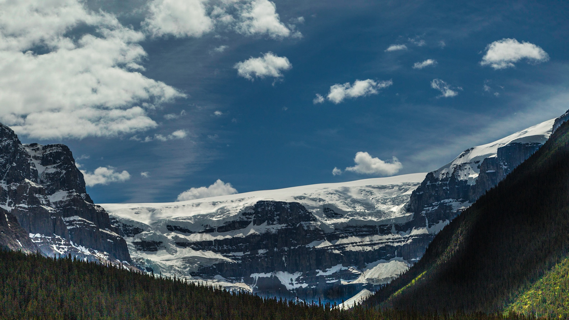 This image was captured because it appears to have an ice wall or face for the Columbia Ice Field, beyond these peaks.