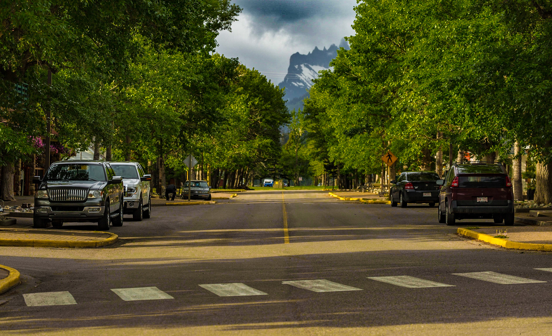 Walking from our hotel to breakfast, I got involved in finding a place to photograph the Prince of Wales Hotel, overlooking the town. Mark and I got separated for a while. The pictures of the hotel were not very satisfying. I did get two centerline shots. One was Waterton Avenue, near the place we were to eat. The other was a walking trail along the lake. When Mark and I found each other, a dud was giving him a line of bull about his personal life adventures. The couple I heard were highly improbable. It was funny. We were ready for breakfast.
