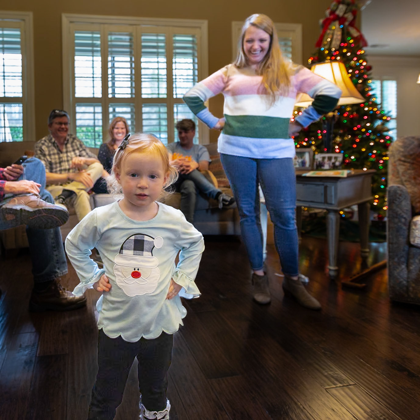 Ella Grace Swinger remined me of the Fearless Girl statue that was first installed at the northern tip of Bowling Green on Broadway, facing down the Charging Bull statue. Following complaints from that statue's sculptor, Arturo Di Modica, it was removed in November 2018 and relocated to its current location the following month. A plaque with footprints was placed on the original site of Fearless Girl.                  Fearless Girl is a bronze sculpture by Kristen Visbal, on Broad Street across from the New York Stock Exchange Building in the Financial District of Manhattan in New York City. The statue was installed on March 7, 2017, in anticipation of International Women's Day the following day. It depicts a 4-foot high (1.2 m) girl promoting female empowerment.