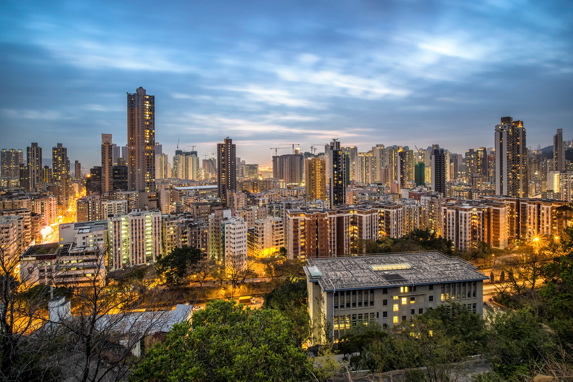 View from Garden Hill Observatory near Sham Shui Po, Hong Kong. A place crowded with many people enjoying the view, taking pictures or posing for some selfies. A nice spot to watch the sunset, although I wasn't so lucky. The closer to the sunset we came, the bigger the clouds got. Still a great view though!