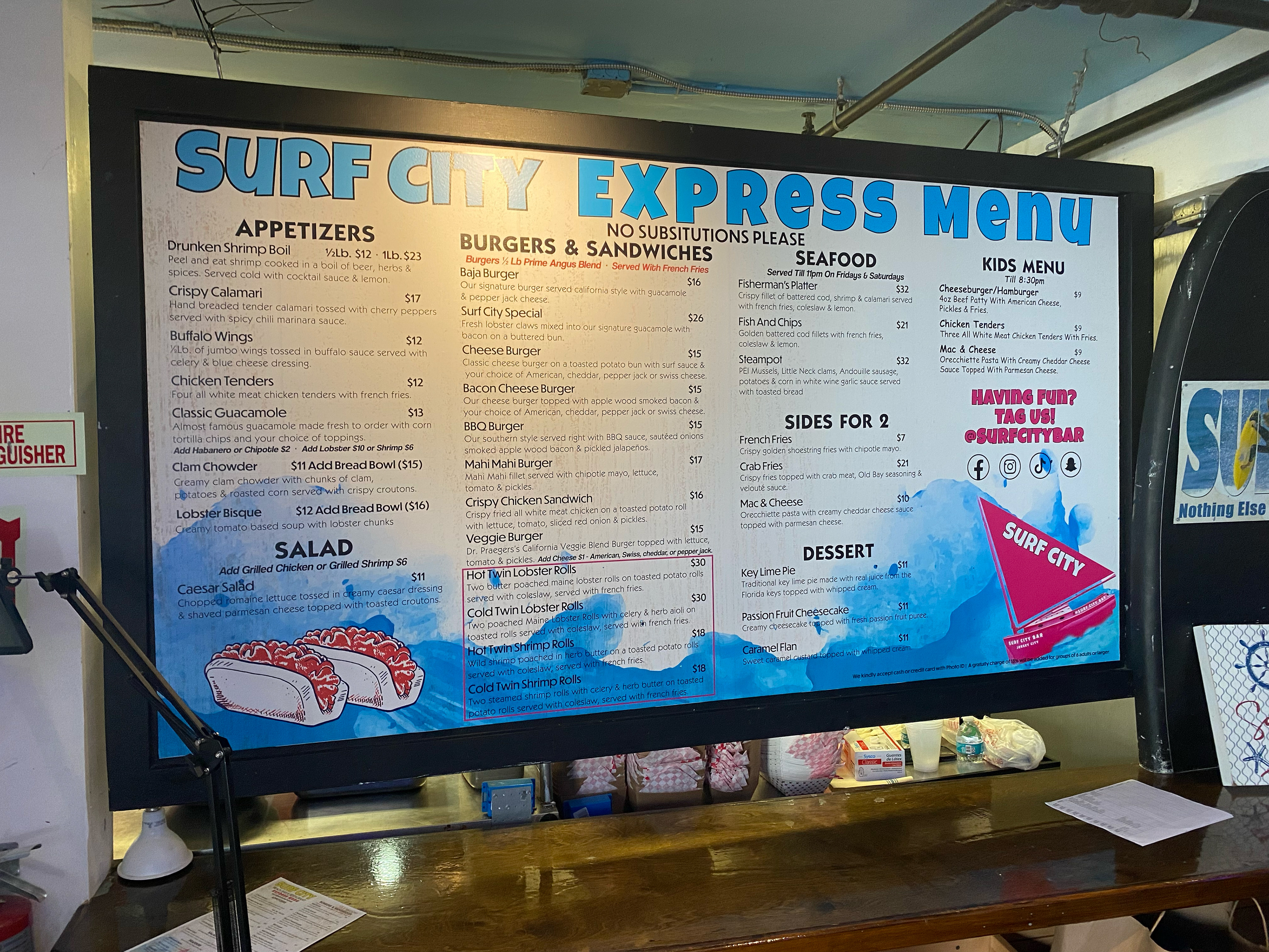 Designed in house, printed in house on sticky vinyl and installed for Surf City of Liberty Harbor