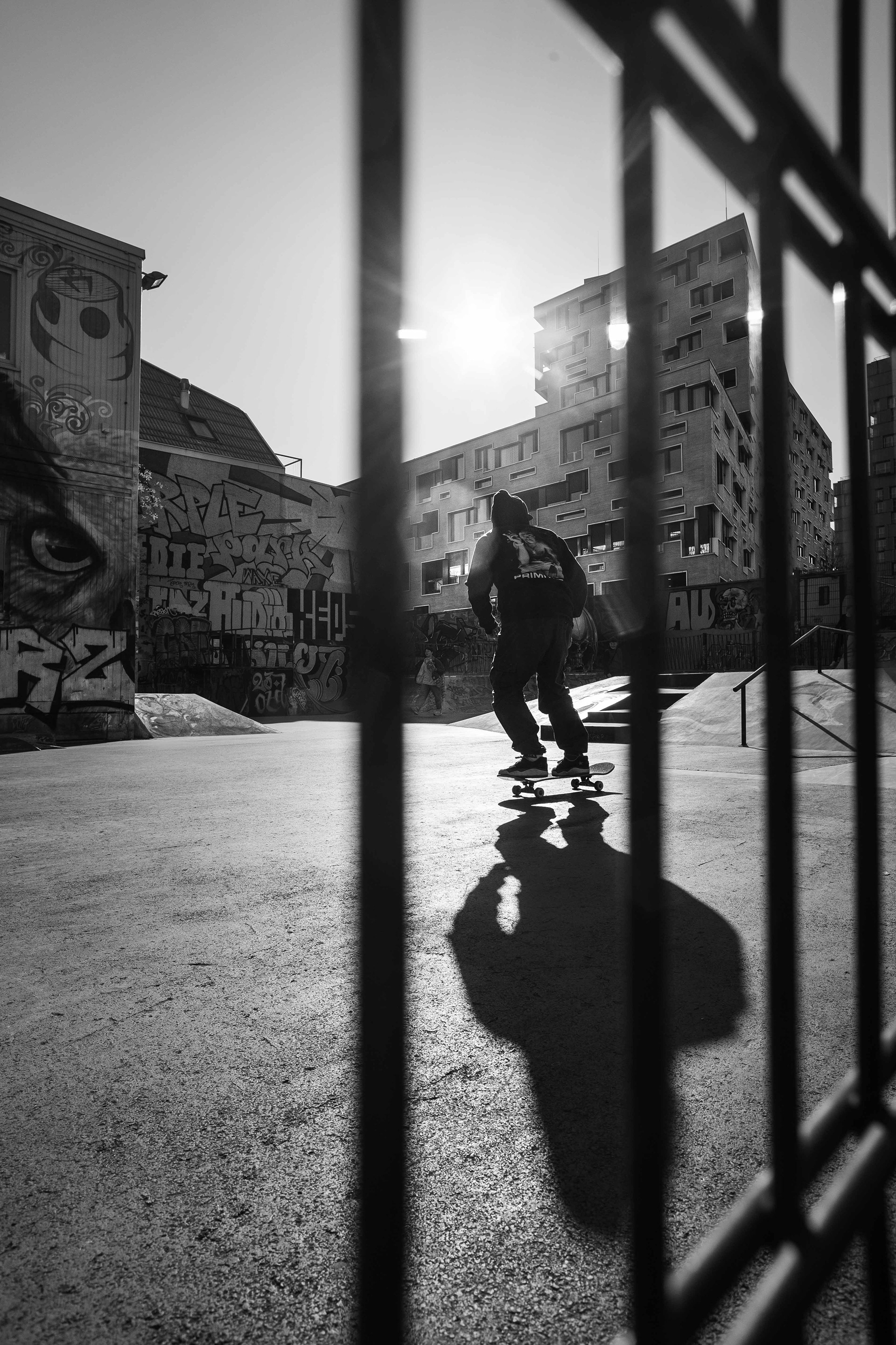 Captured during the final moments before sunset, the sun glowing in the background casts the skateboarder at Purple Park Basel into a striking silhouette, creating a beautiful interplay between light and shadow. Photography by Carmine Castelli