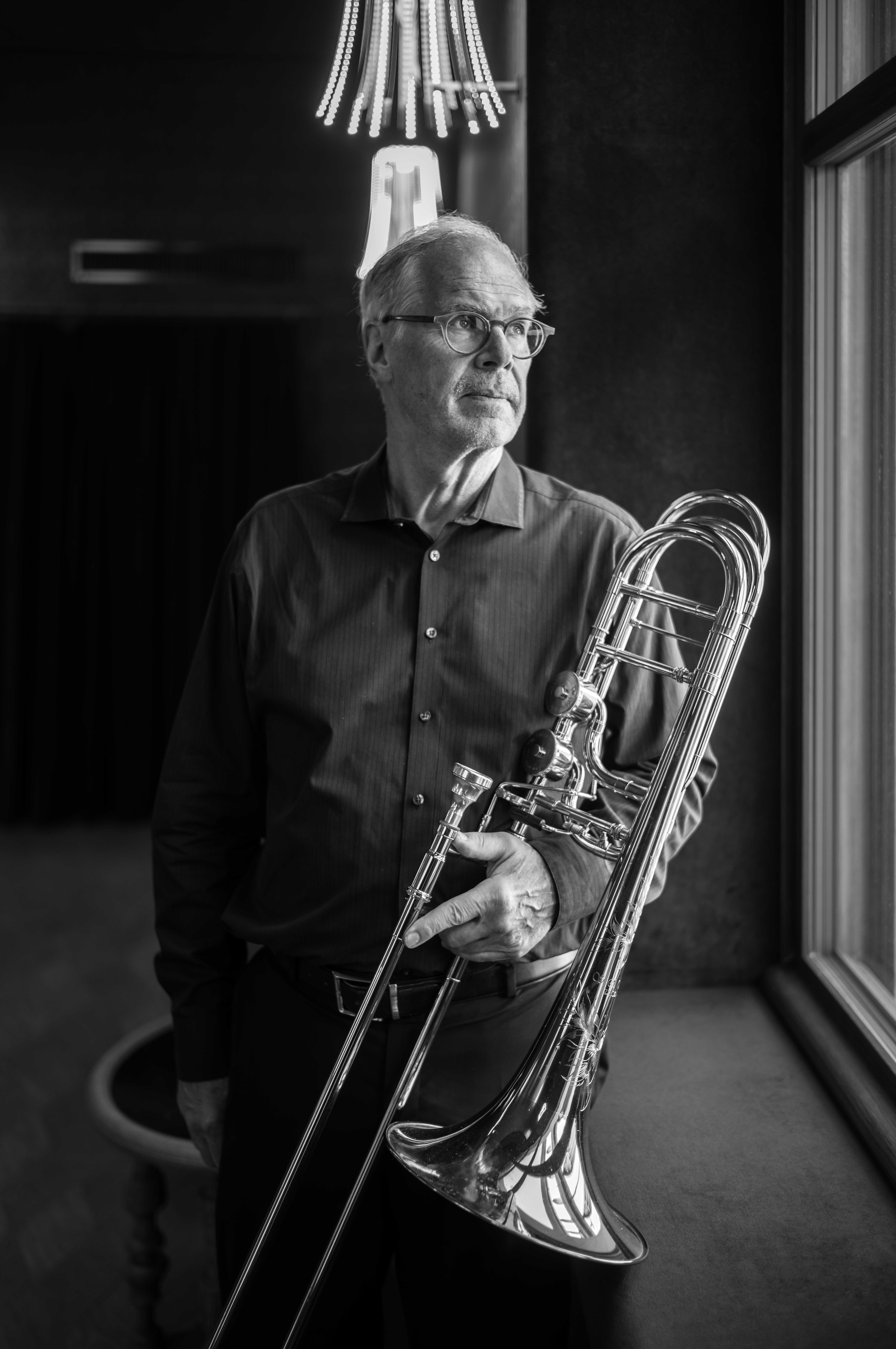 Portrait of Prof. Dr. Thierry Carrel with his trombone at SMOMS at Stadtcasino Basel. What we encountered was warmth, humility, and a deep sense of dedication. 
