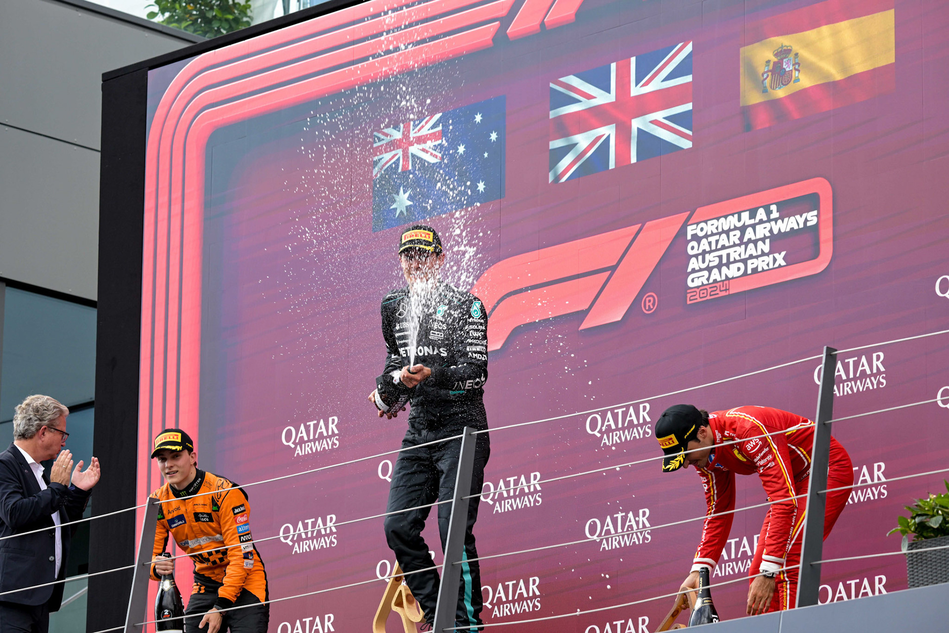 George Russell #63, Mercedes-AMG Petronas F1 Team und Oscar Piastri #81, McLaren Formula 1 Team und Carlos Sainz #55, Scuderia Ferrari auf dem Podium.;Formel 1 GP Austria / Österreich. Sonntag, 30.06.2024