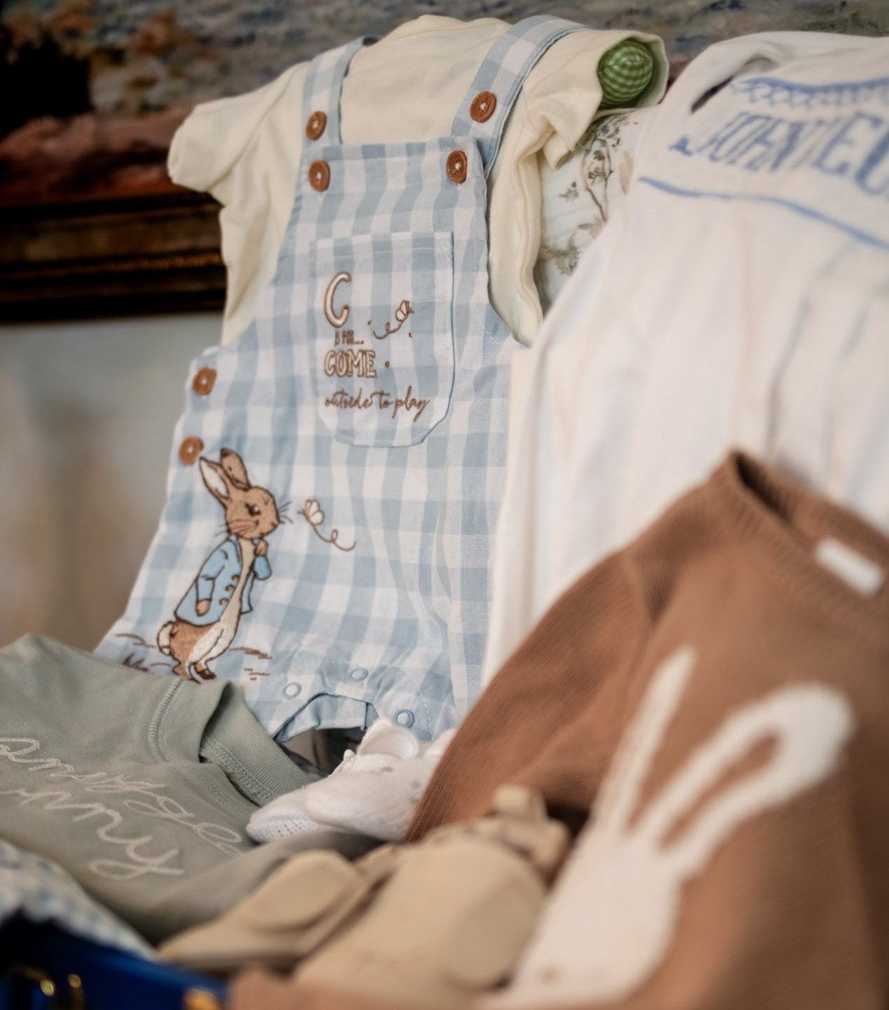 Editorial baby shower photography highlighting thoughtful, curated gifts in a custom keepsake trunk.