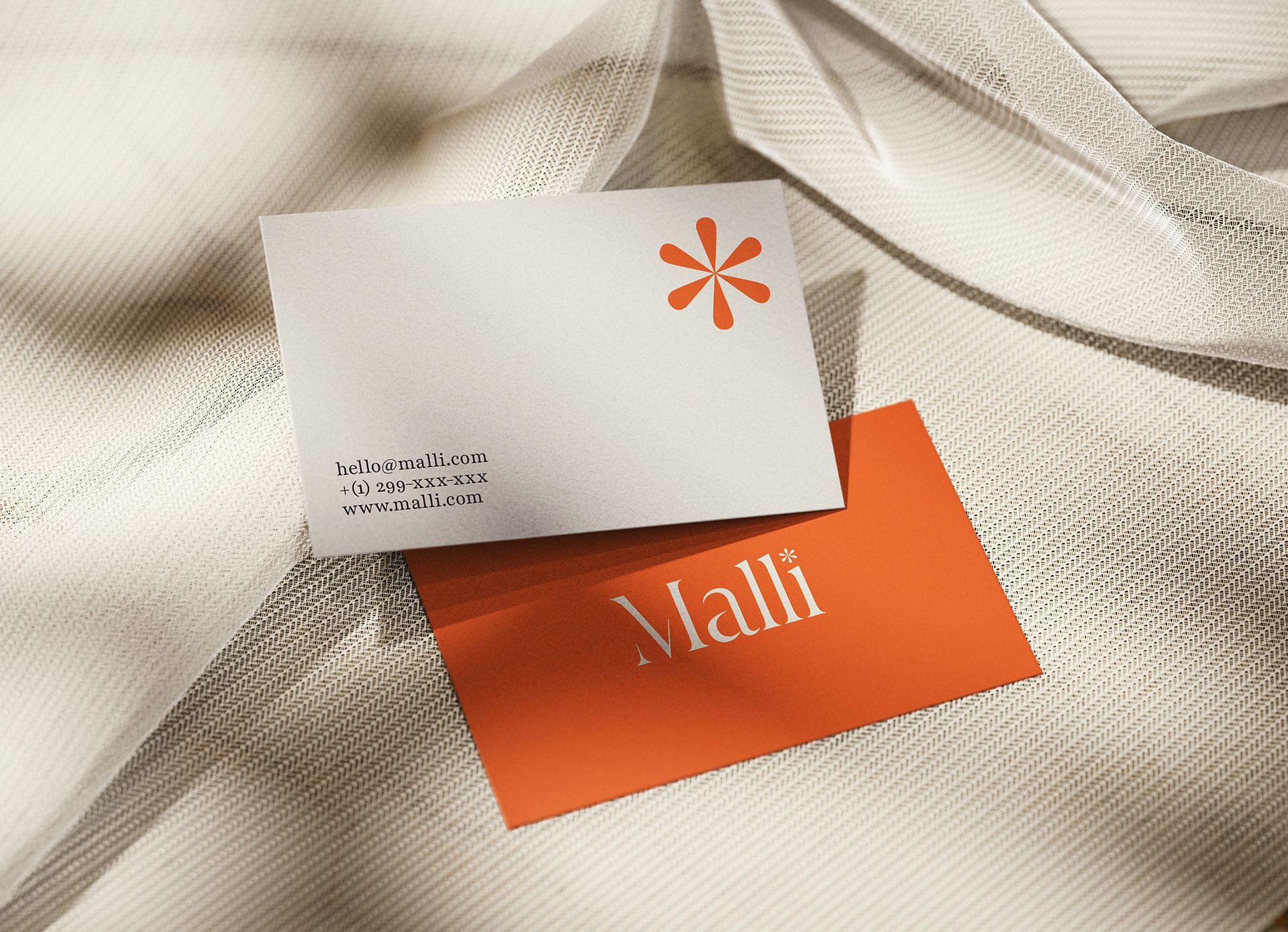 business card photographed against a cloth
