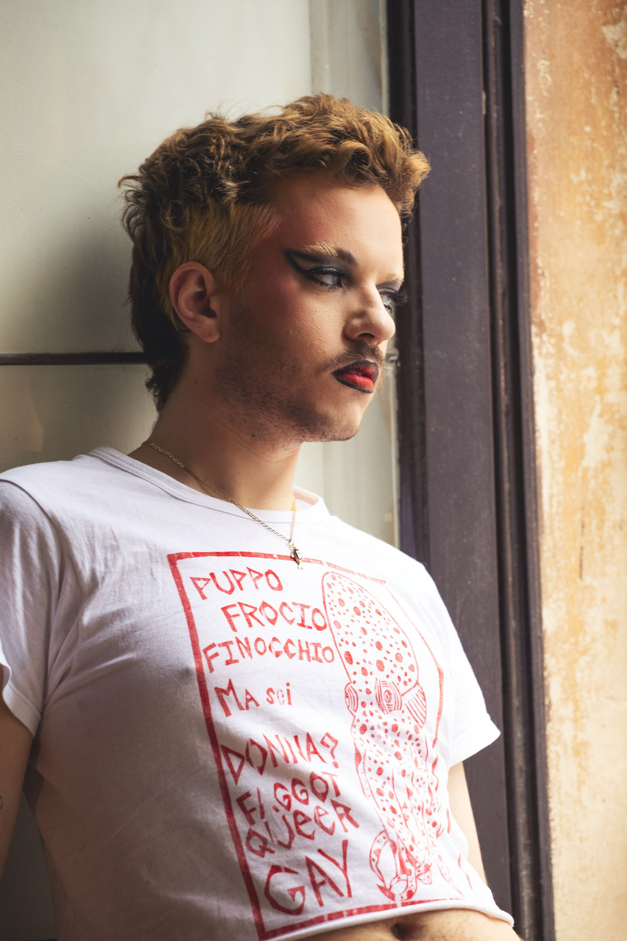 Fabrizio Recently returning to Catania Fabrizio had to face the misunderstanding and hostility of who cannot accept his free expression. He chose so to transform the insults into a powerful message of rebellion, he meticulously stitched each offensive word he received onto a white T-shirt, creating a masterpiece of resilience and reclaiming his identity.