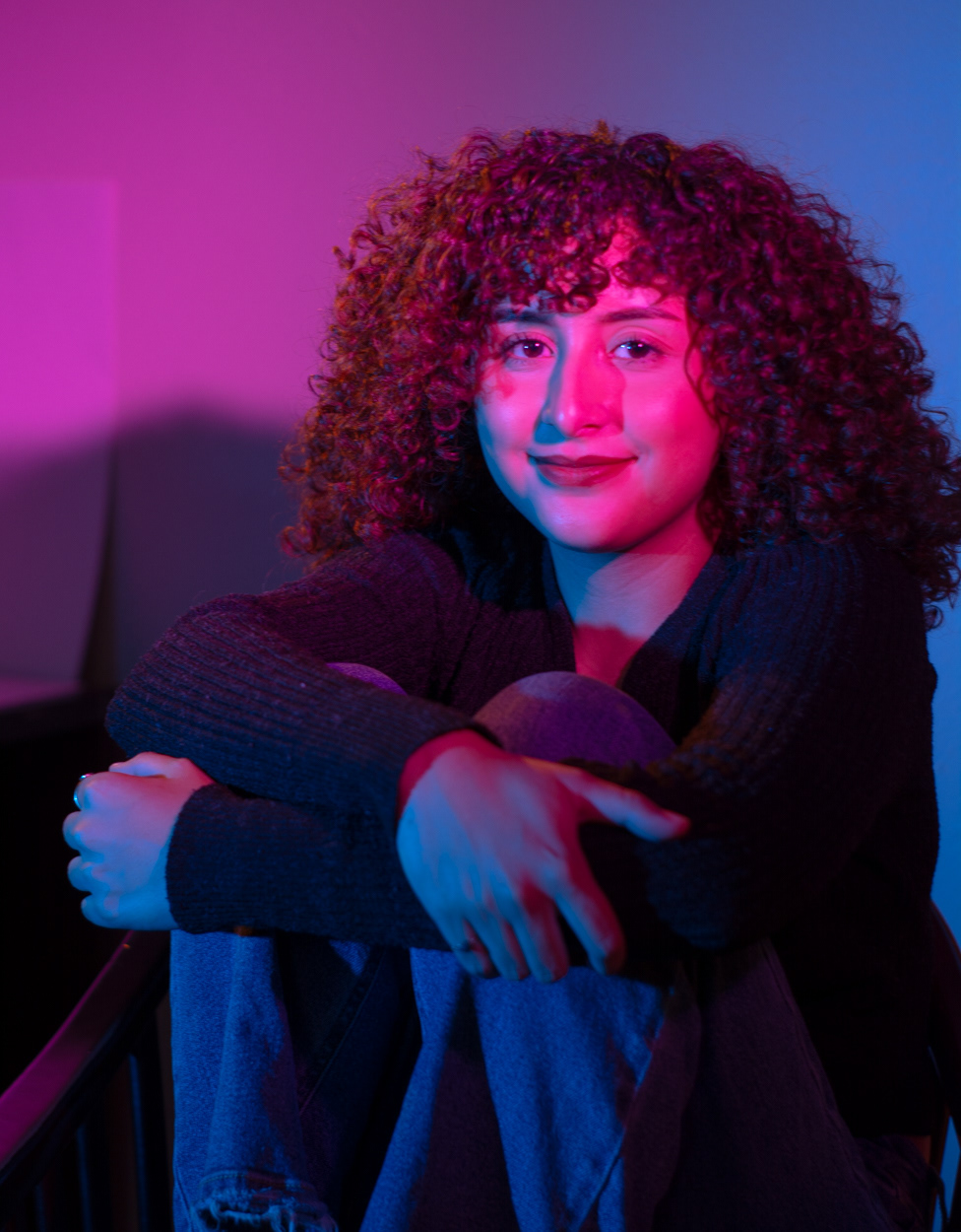 self portrait with pink and blue background