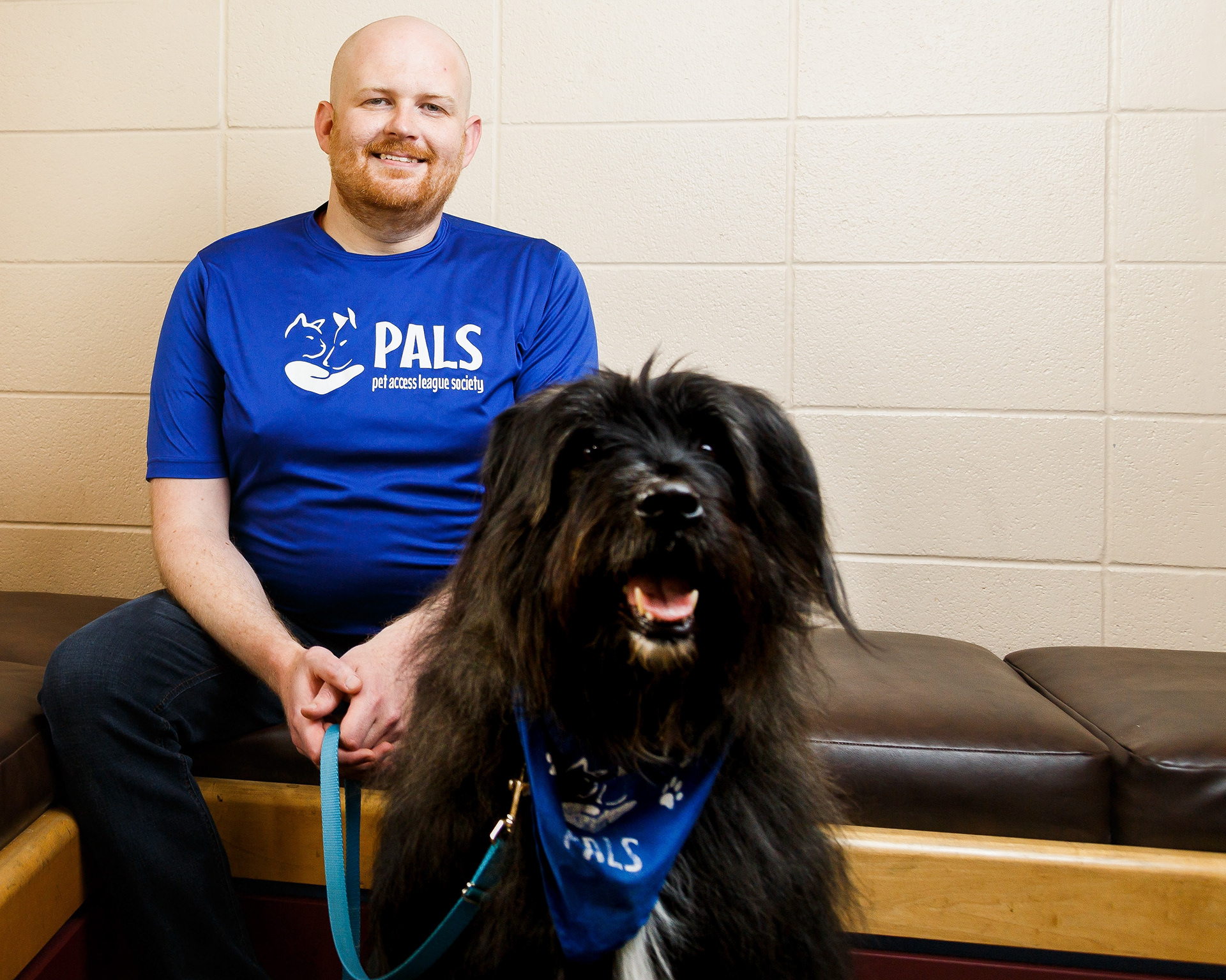 Keith Baker and his dog Seymour pose for a photo in Calgary on Tuesday, June 7, 2022. Baker has been volunteering with the Pet Access League Society (PALS) for over three years. PALS is a volunteer non-profit that provides visitation pet therapy to those who need it.