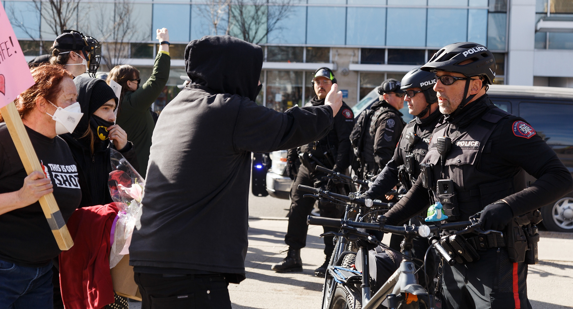 A counter-protest talks to police after another counter-protester was arrested in Calgary on Saturday, March 19, 2022. Community Solidary Calgary organized the counter-protesters, and they are asking for an end to the weekly protest by Calgary Freedom Central.
