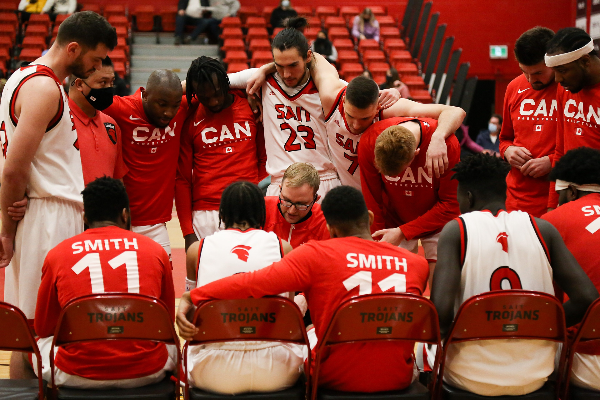 SAIT Trojans take a time out during their game against the Kodiaks at SAIT’s Campus Centre gym in Calgary on Saturday, Feb. 19, 2022. The Trojans defeated the Kodiaks 69-68 during Alberta Colleges Athletic Conference regular-season play.