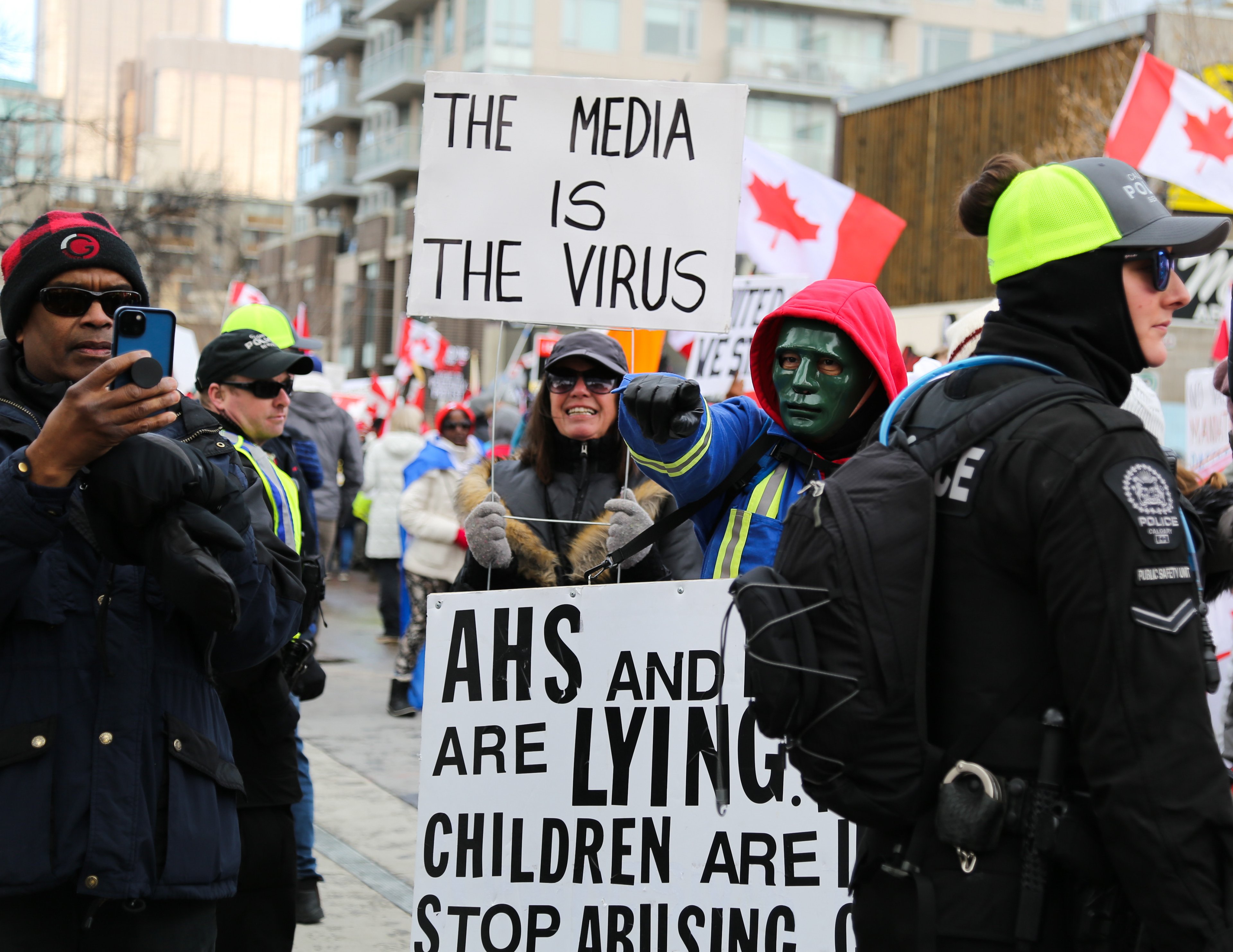 Members of the Calgary Freedom Central group that are protesting against COVID-19 health mandates clash with a group of counter-protestors at 17th Avenue and 7th Street SW in Calgary on Saturday, March 5, 2022. The counter-protesters blocked the protestors from continuing down 17th Ave. (Photo by Anna Burns for LiveWire Calgary)