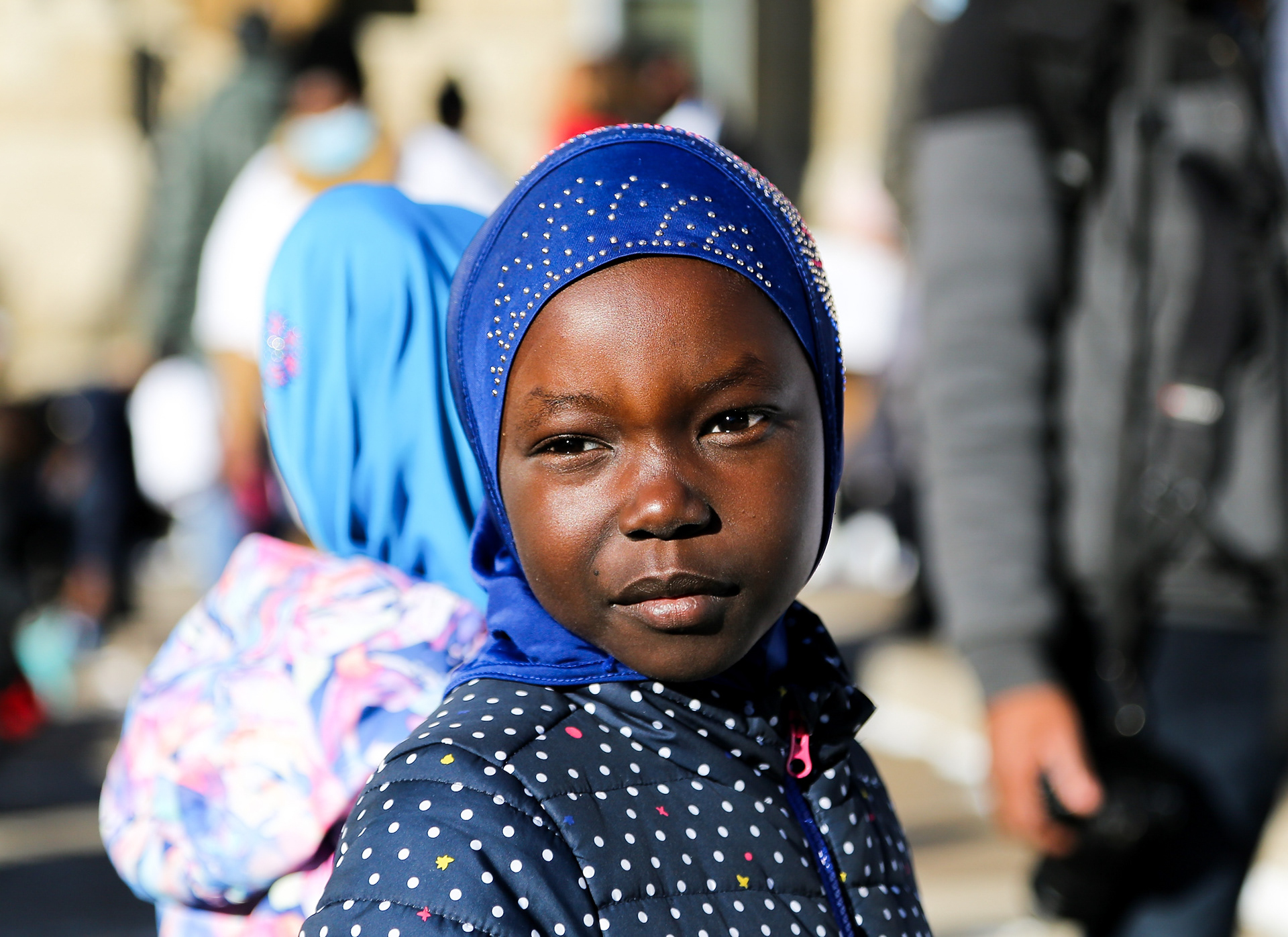 A young girl stands in front of city hall in Calgary on Friday, Feb. 25, 2022 to demand justice for Latjor Tuel. Tuel was a South Sudanese man shot and killed by the Calgary police on February 19th. The event was organized by Calgary’s African Community Collective in support of Calgary’s South Sudanese community.