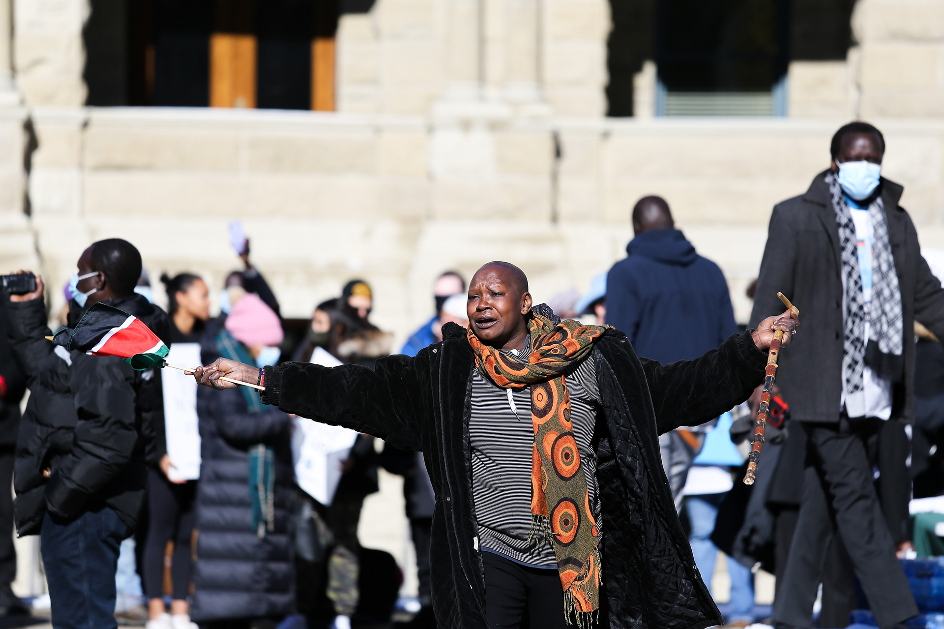 A relative of Latjor Tuel stands in front of city hall in Calgary on Friday, Feb. 25, 2022 to demand justice for Latjor Tuel. Tuel was a South Sudanese man shot and killed by the Calgary police on February 19th. The event was organized by Calgary’s African Community Collective in support of Calgary’s South Sudanese community.