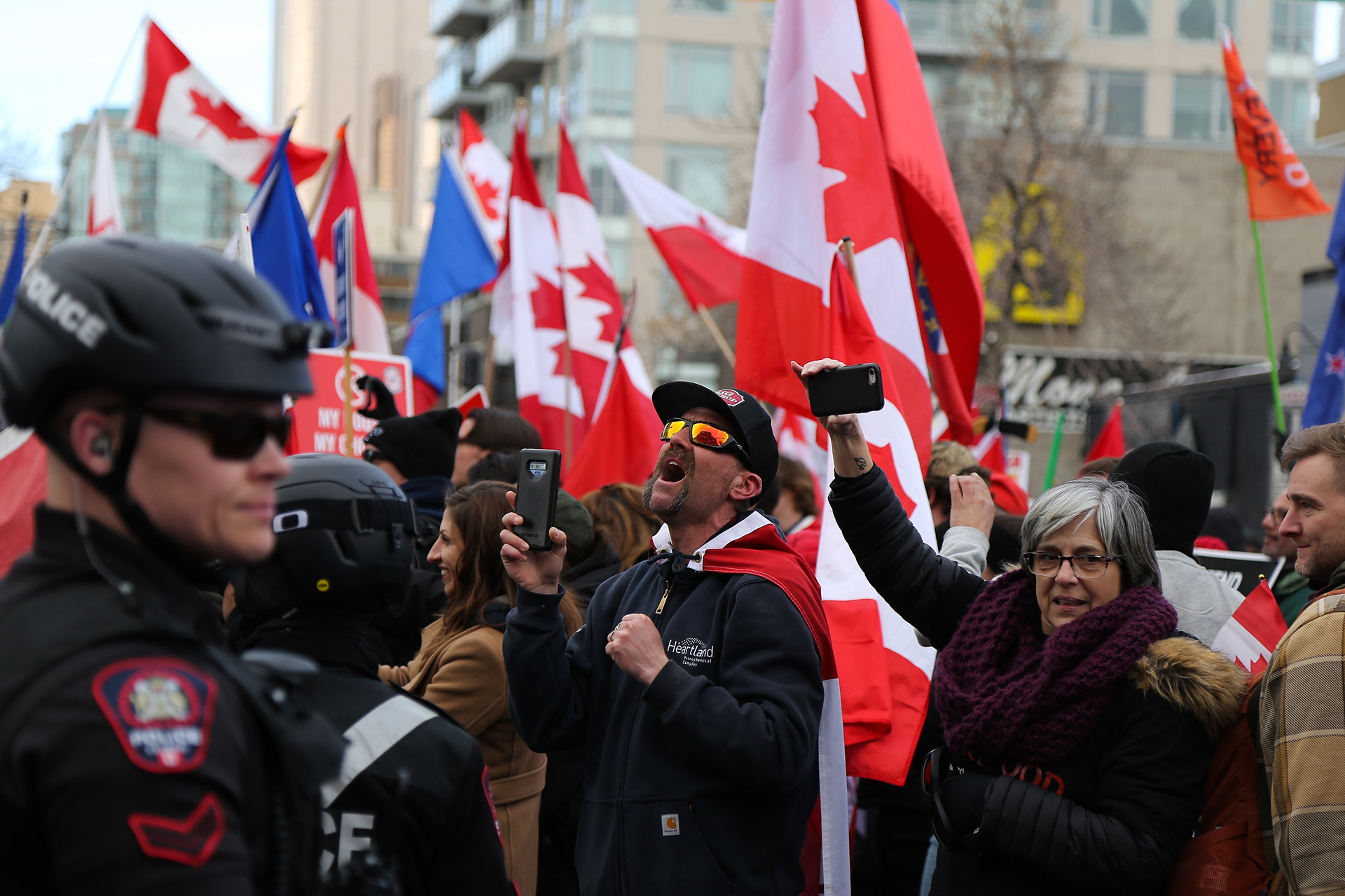 A member of the Calgary Freedom Central shouts at a group of counter-protestors at 17th Avenue and 7th Street SW in Calgary on Saturday, March 5, 2022. The counter-protesters blocked the protestors from continuing down 17th Ave. (Photo by Anna Burns for LiveWire Calgary)