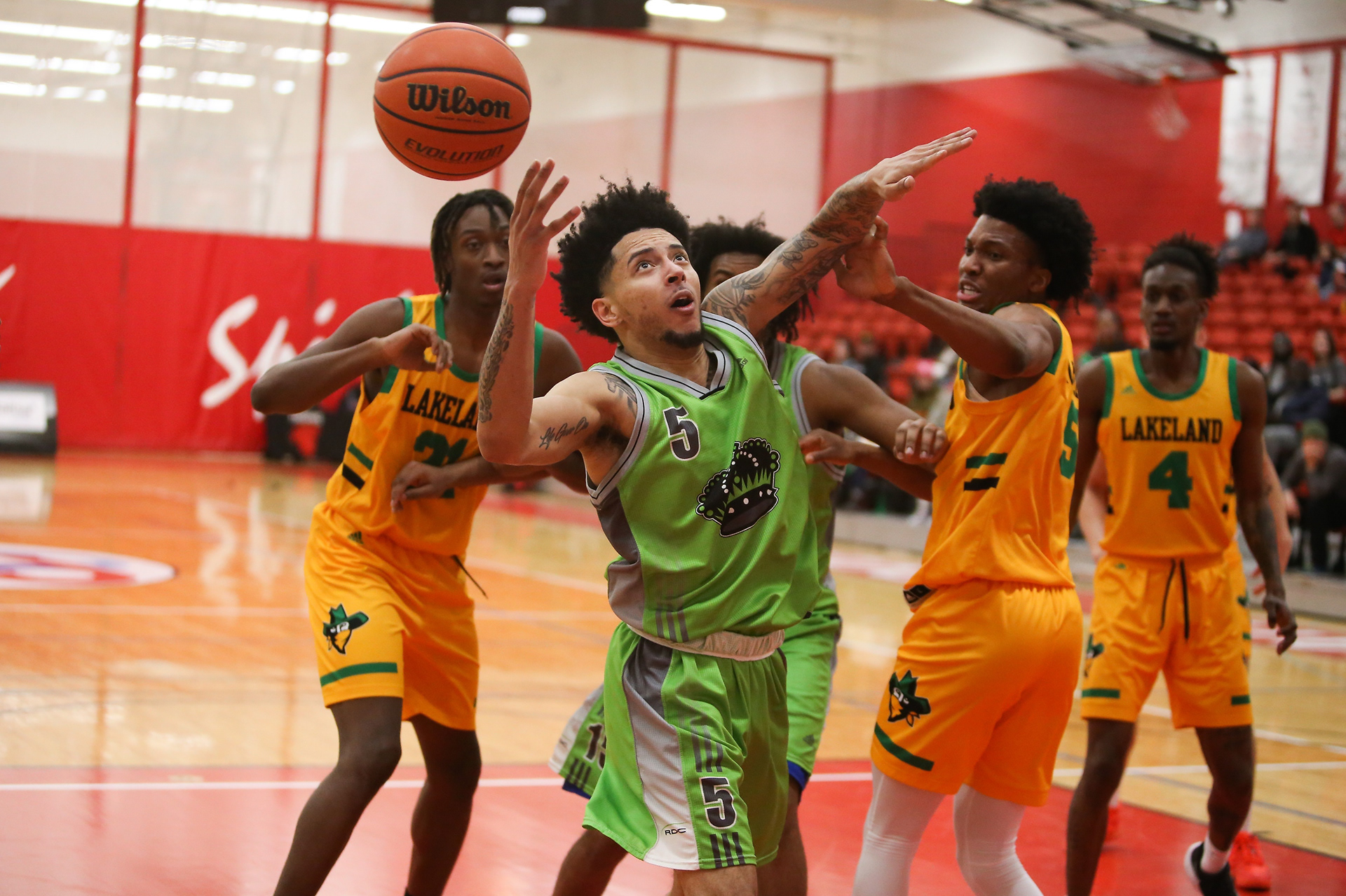 Red Deer College Kings guard Tyronn King battles for the ball with Lakeland College Rustlers guard/forward Shaquai Manswell at SAIT’s Campus Centre gym in Calgary on Saturday, March 12, 2022. The Lakeland College Rustlers defeated the Red Deer College Kings 82- 79 during Alberta Colleges Athletic Conference bronze medal championship game.