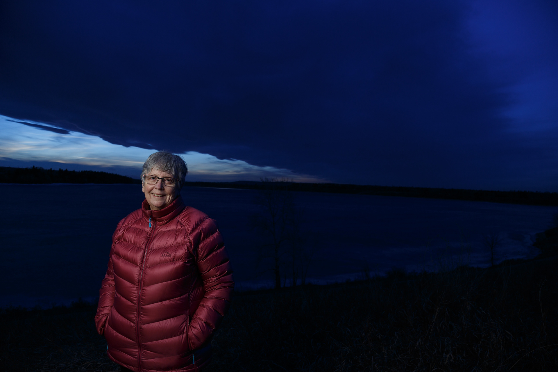 Jill Burns poses for a portrait at South Glenmore Park in Calgary on Thursday, April 7, 2022. Burns moved close to the park eight years ago with her husband, Dennis.