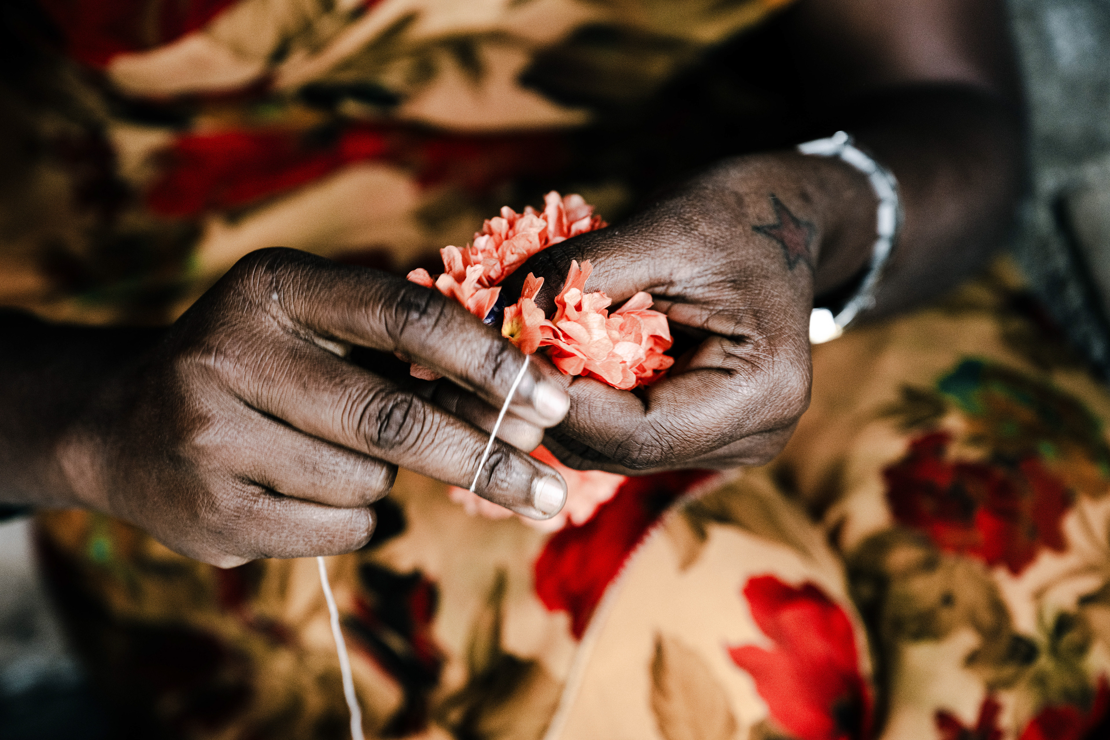 Garland maker at Flower Market, Bengaluru, India