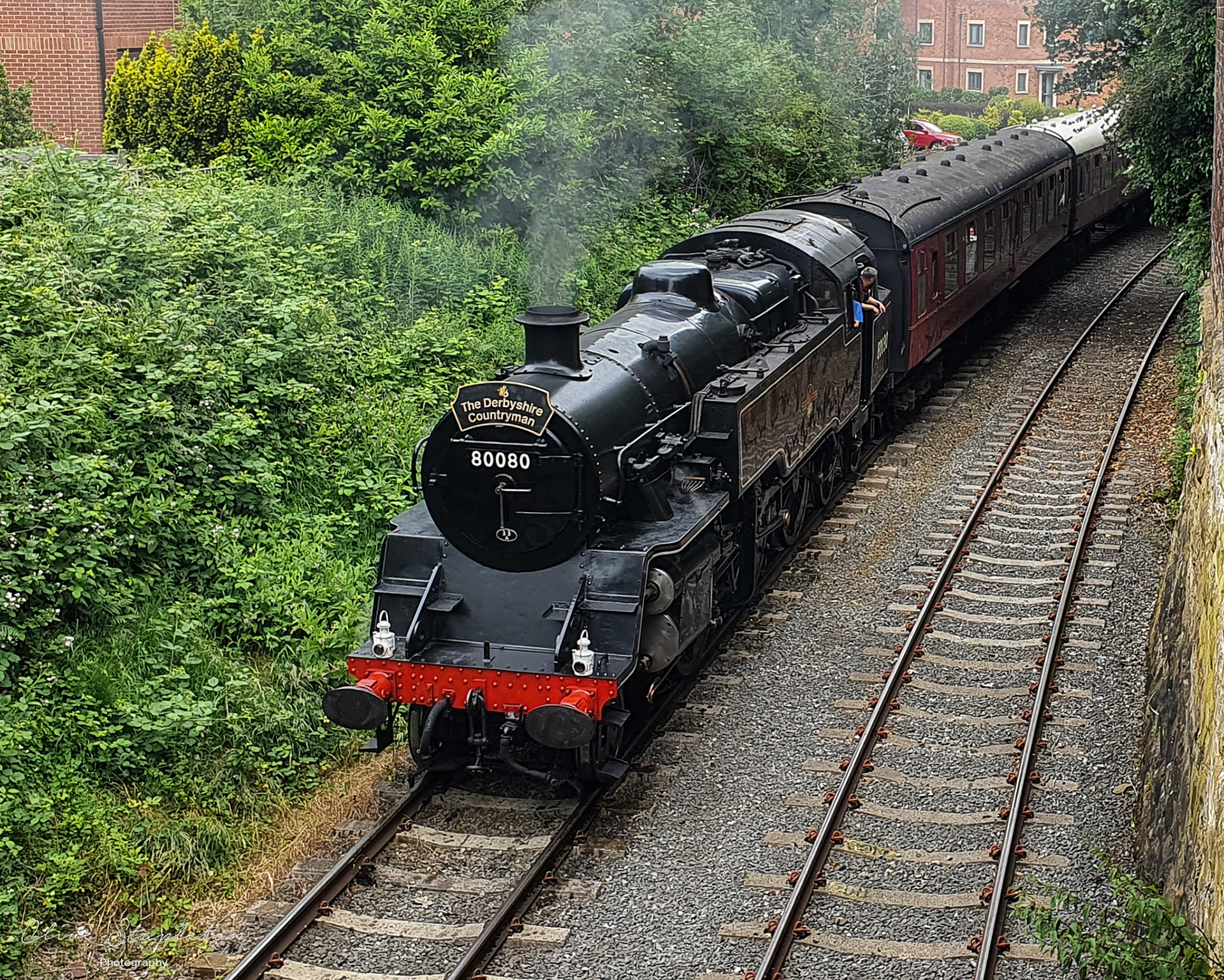 A preserved steam train on the Eccelesbourne Valley Railway at Duffield Station on a Train to Wirksworth on 27th June 2021.