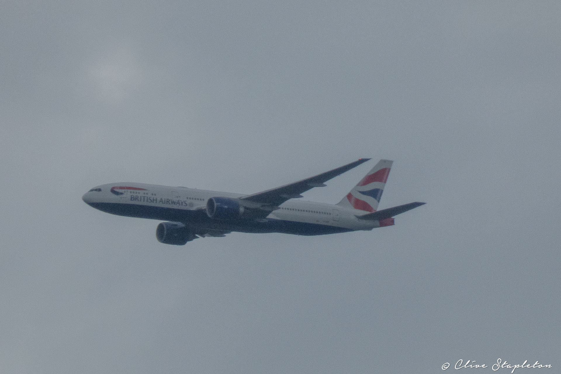A British Airways Boeing 777 flying away from Heathrow Airport.