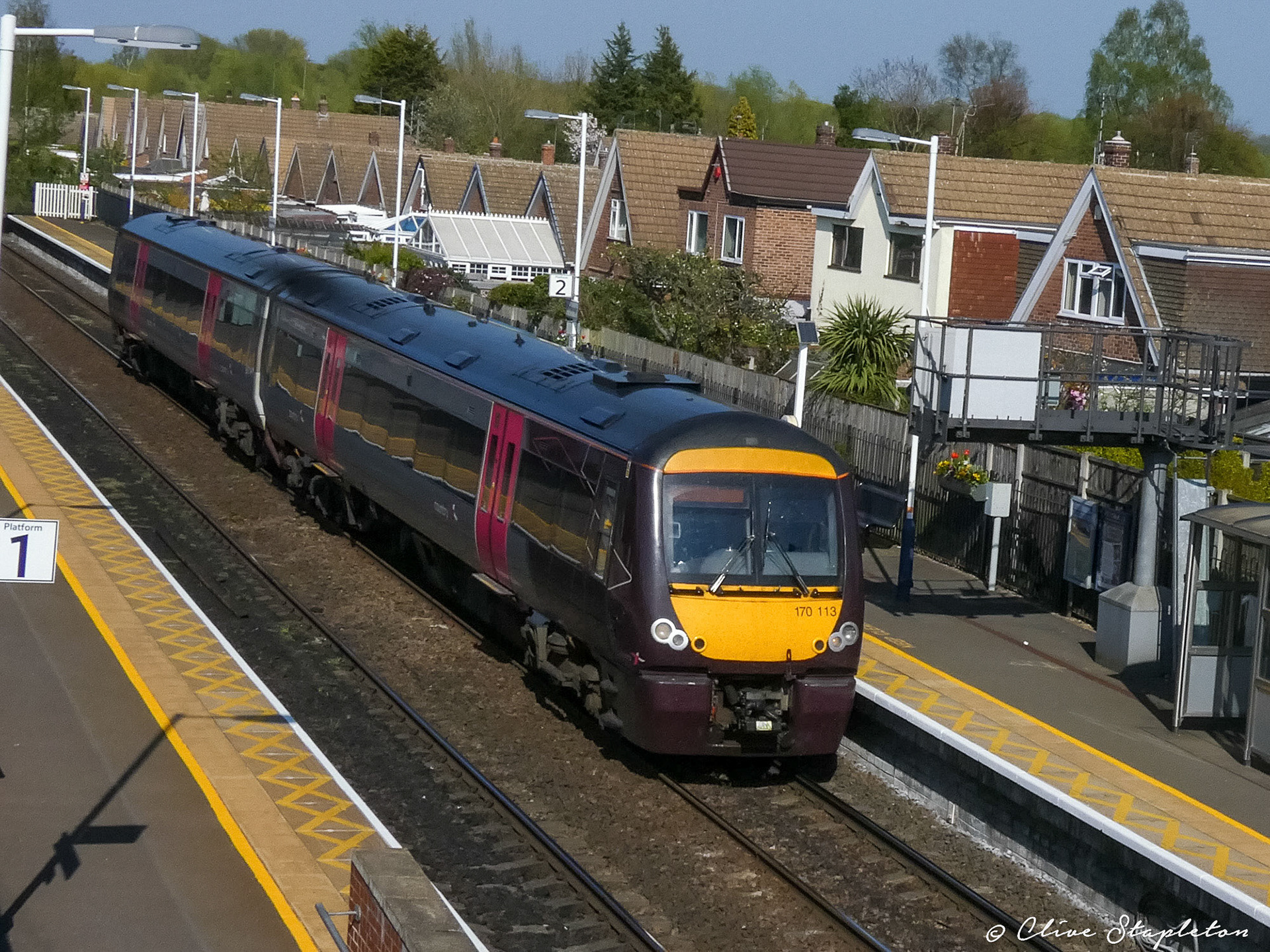 A class 170 heads through Attenborough Station towards Derby.