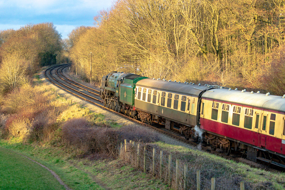 BR Standard Class 9F 2-10-0 Steam Locomotive No 92214 on a Train from Leicester North to Loughborough viewed from Kinchley Lane near Rothley Leicestershire.