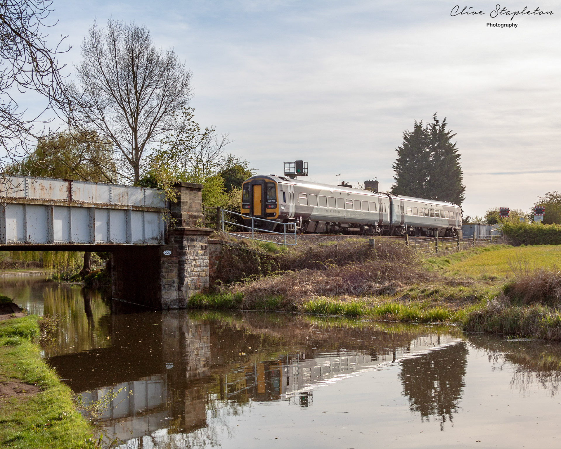 A train crosses the Trent and Mersey Canal near Willington Derbyshire..