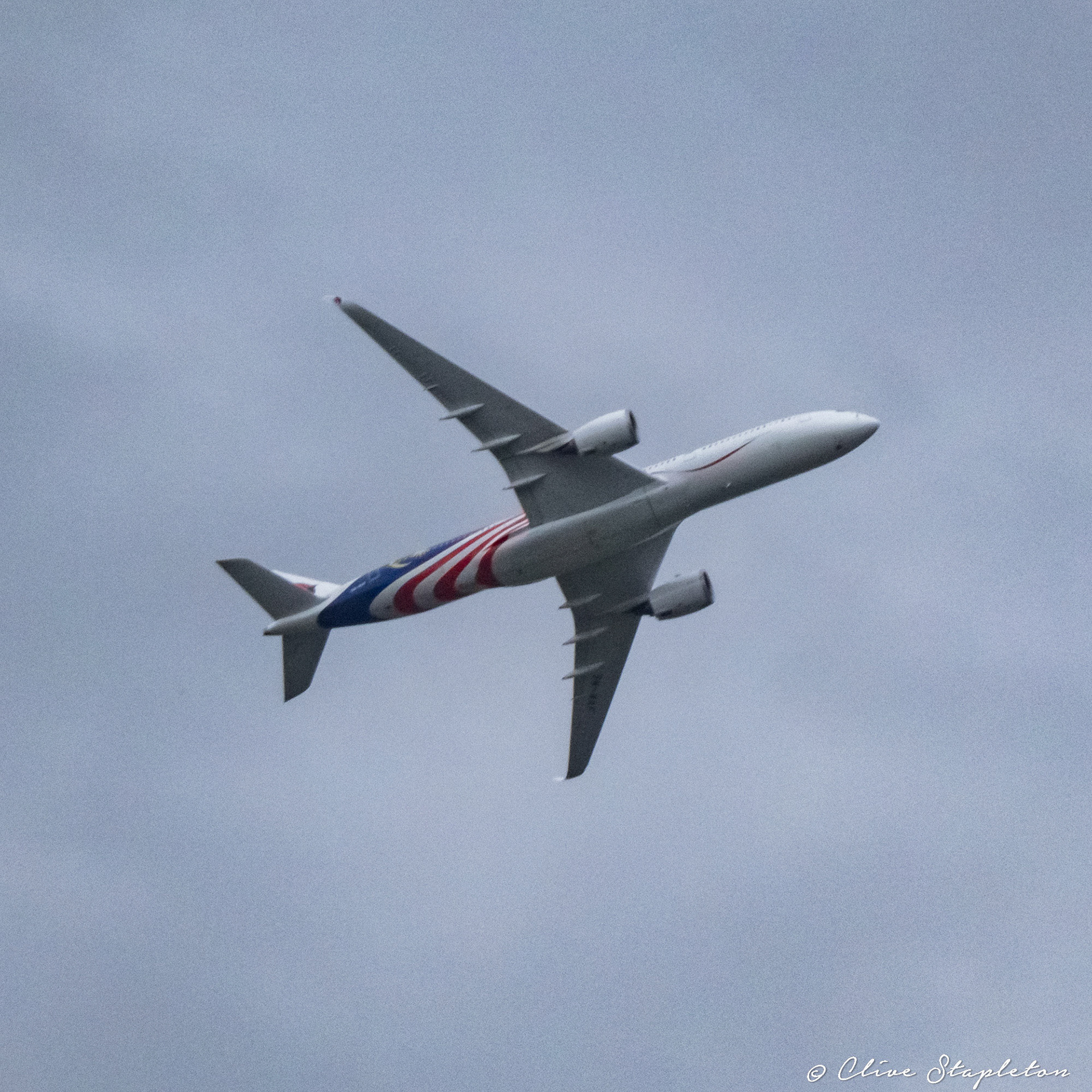 An A350 flying away from Heathrow Airport.